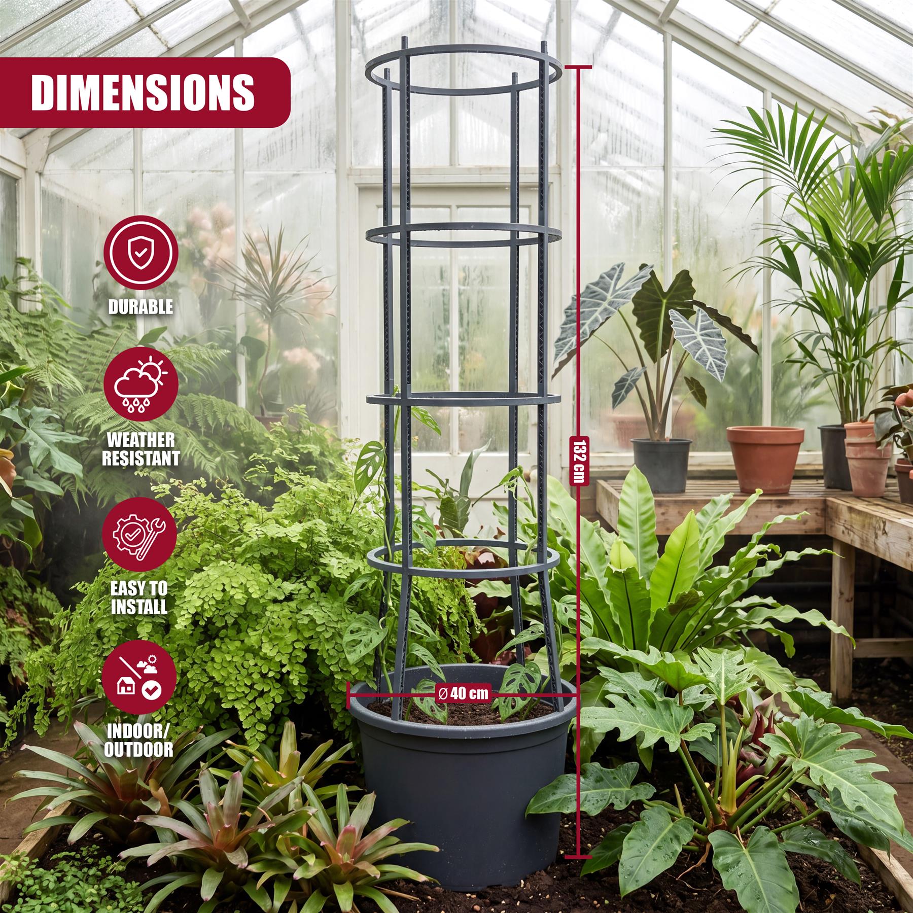 Black metal, four-tiered plant stand housed in a large pot, displayed within a greenhouse setting.