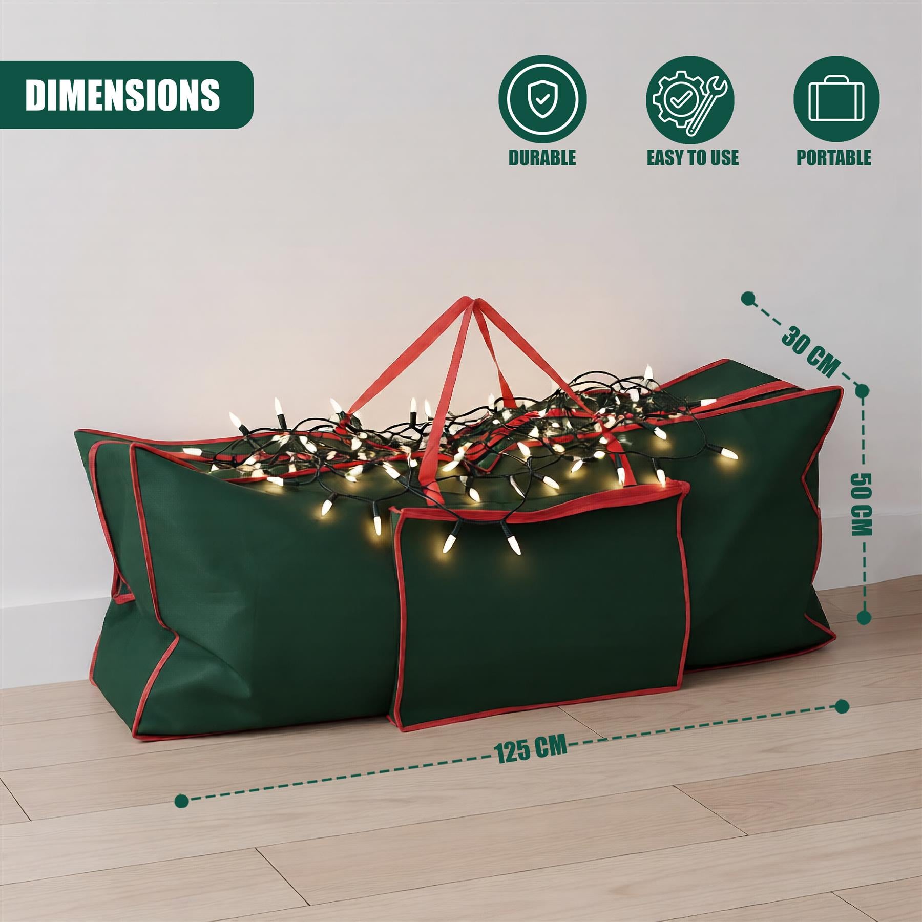 A Christmas storage bag with a green and red design, containing a tangled string of lights. The bag has a handle and is sitting on a wooden floor, with a white wall in the background. The bag's dimensions are shown in green text, with a green line connecting the measurements. The bag is designed to store and transport Christmas decorations, with a durable and portable design. - The Magic Toy Shop