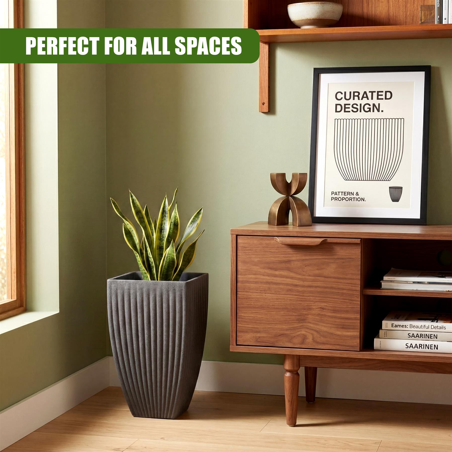Vertical gray pot with ribbed sides holding a vibrant, potted green plant.
