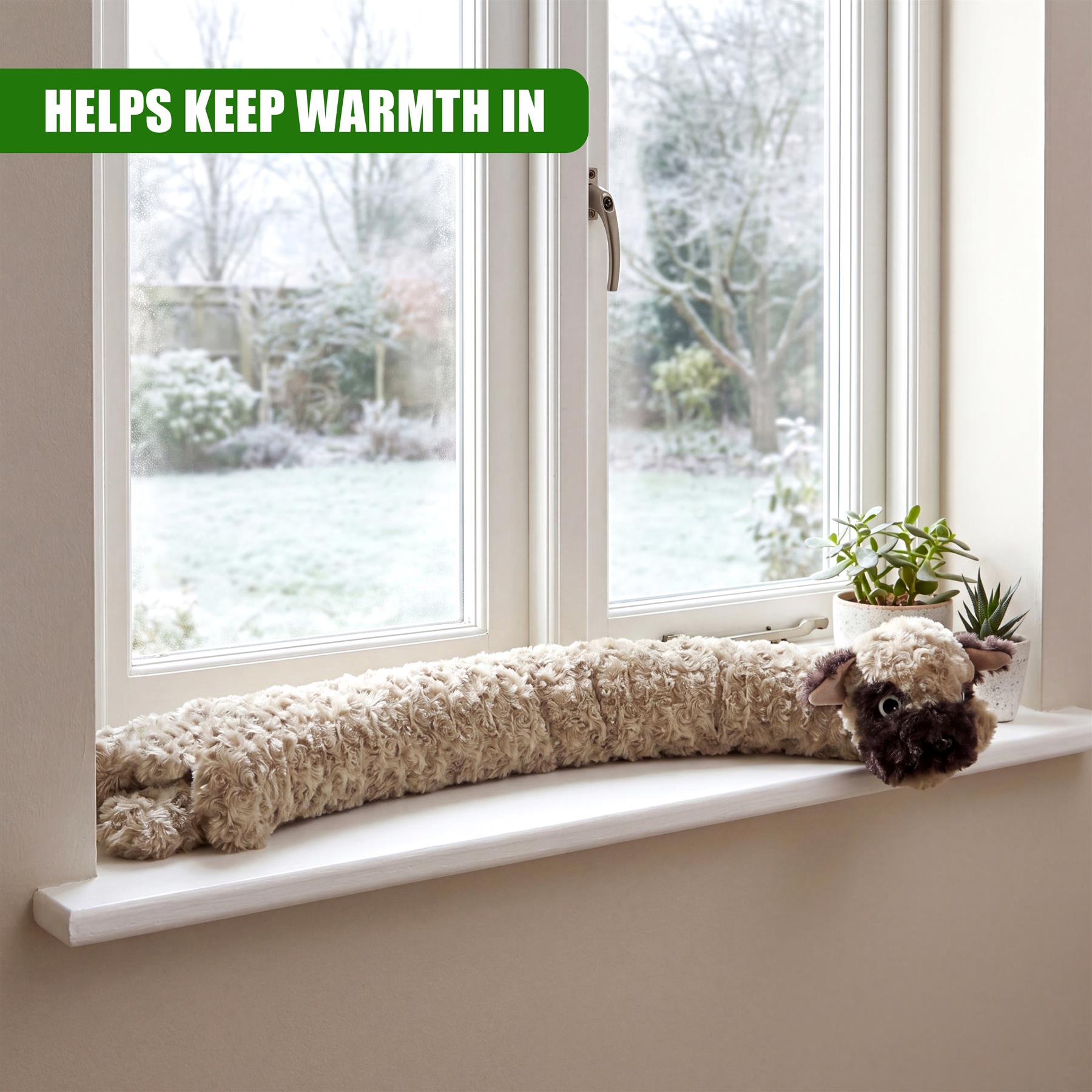 Brown, stuffed dog draught excluder placed on a windowsill next to small potted plants.