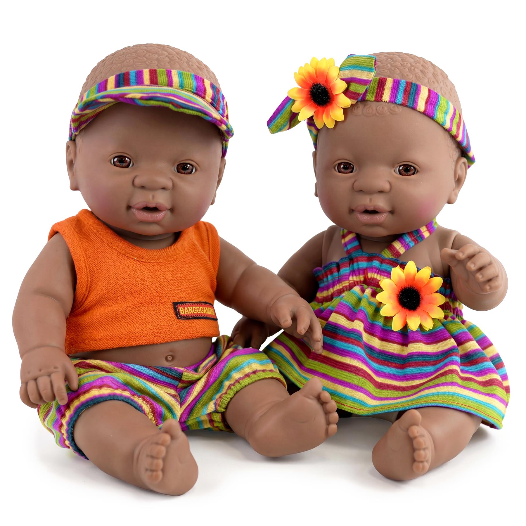 A pair of matching twin dolls, both colored black, posed side by side on a surface.
