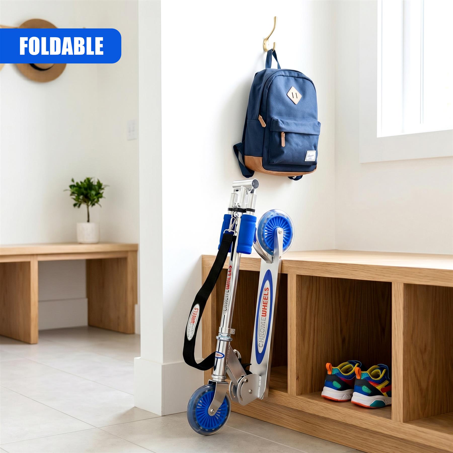 Foldable blue scooter hangs on a wall unit, positioned next to a dark backpack and colorful shoes.