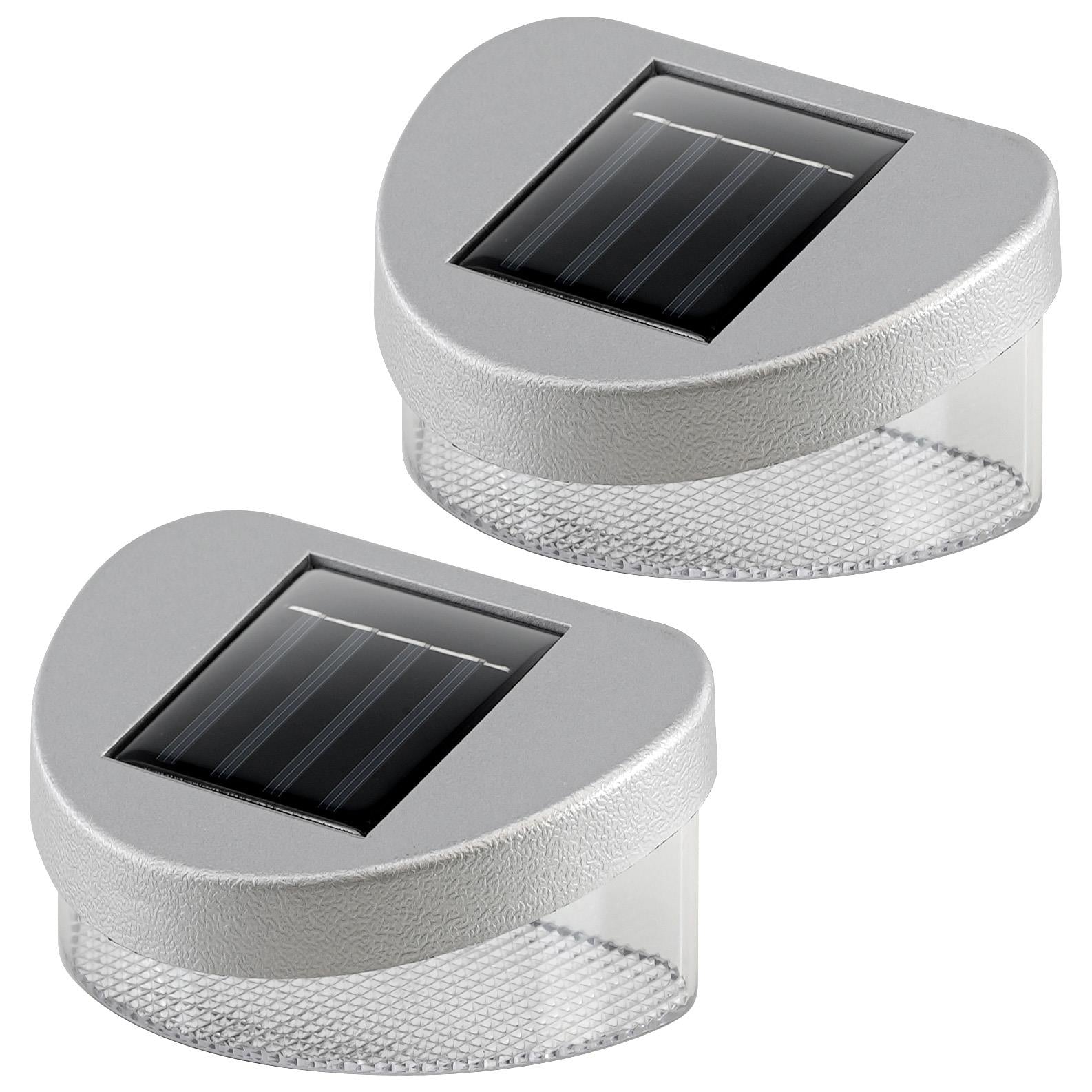 Two solar fence lights featuring square dark panels and cylindrical perforated gray plastic housings.