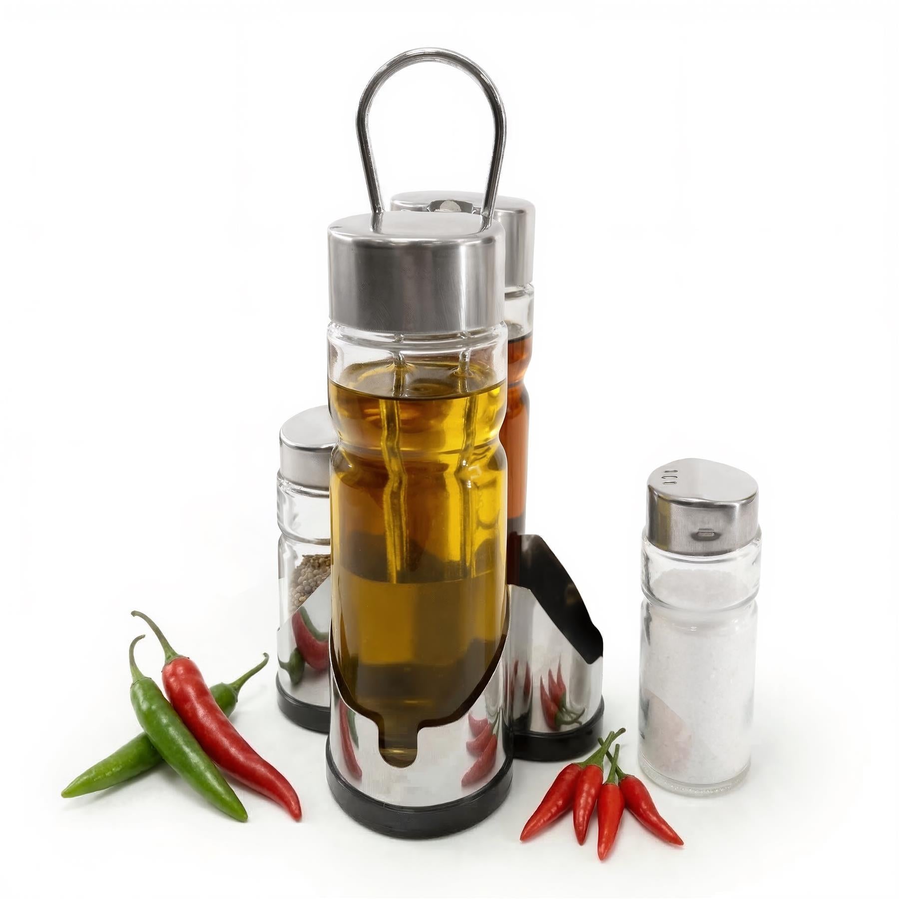 Four condiment dispensers, including an oil pourer, accompanied by fresh green and red chili peppers.