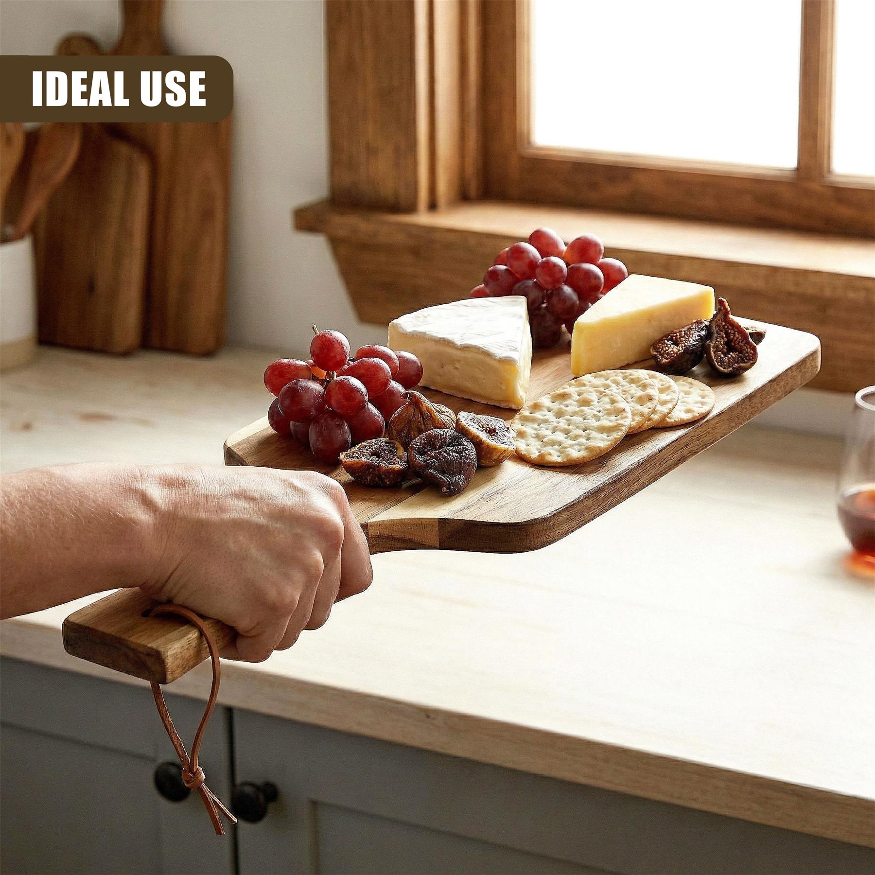 Acacia wood paddle board holding grapes, cheese, crackers, and dried fruit for serving.