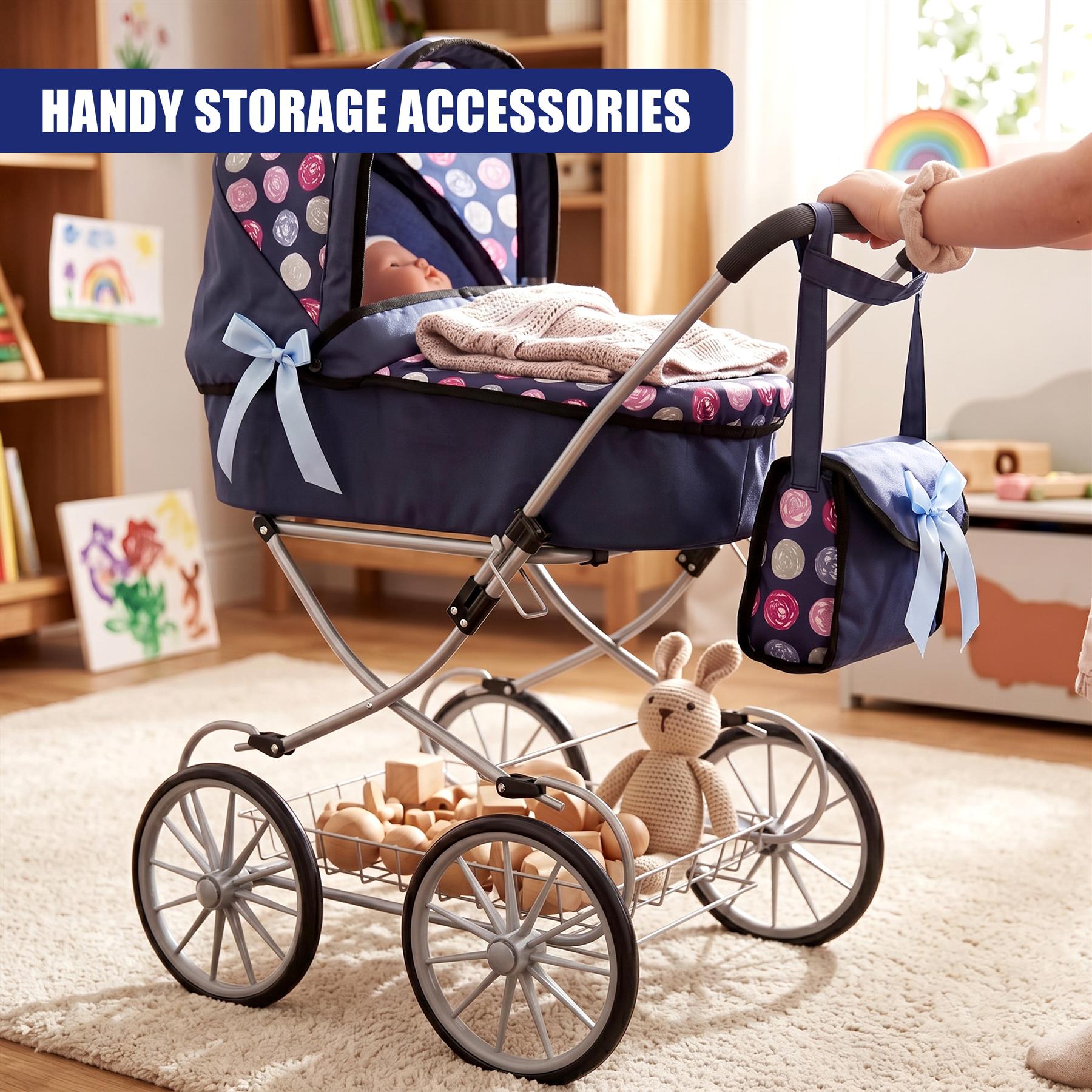 Blue doll pram features a canopy, attached storage bag, and a lower wagon cart loaded with accessories.