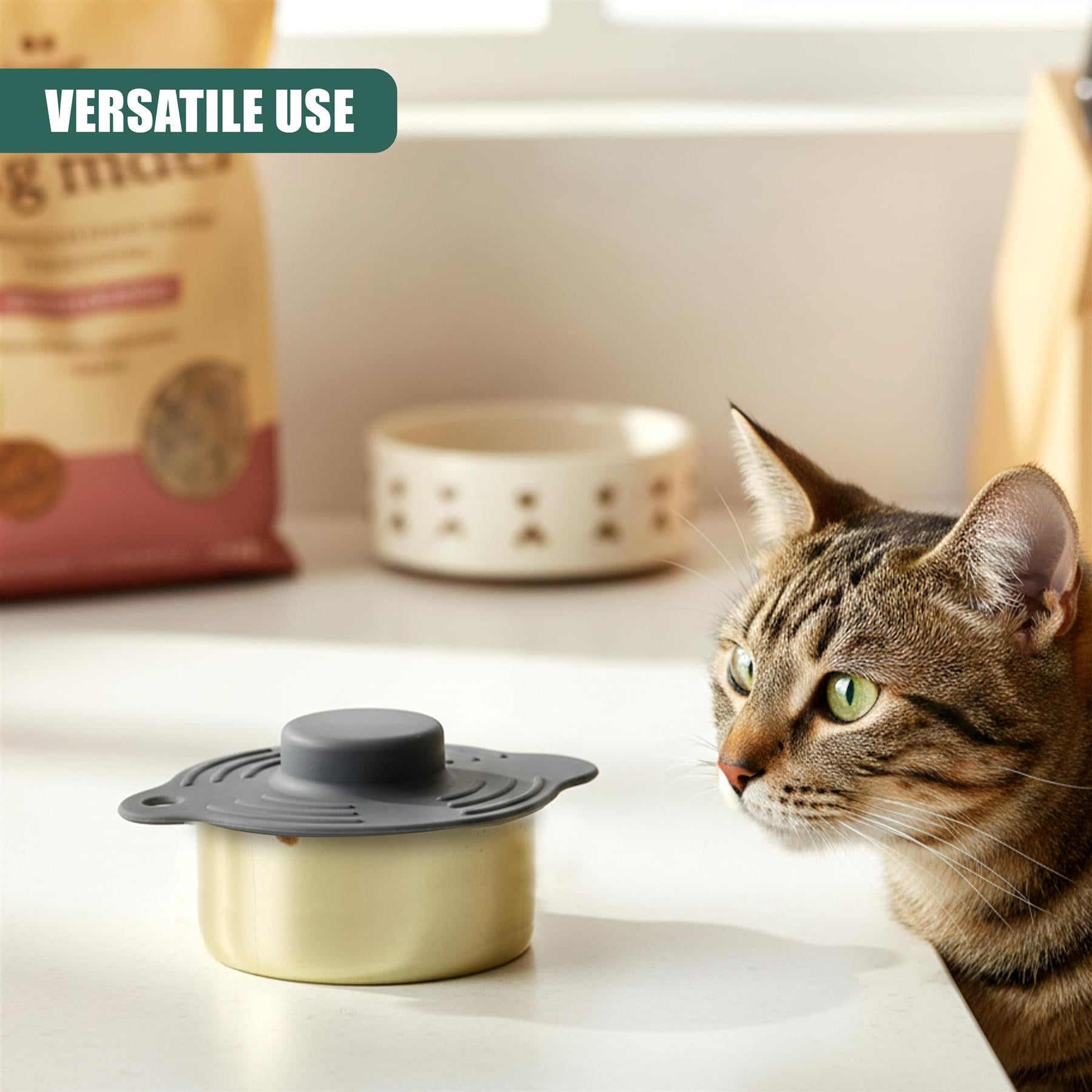 Three silicone pet food covers are displayed on a white counter with a cat and food bag visible.