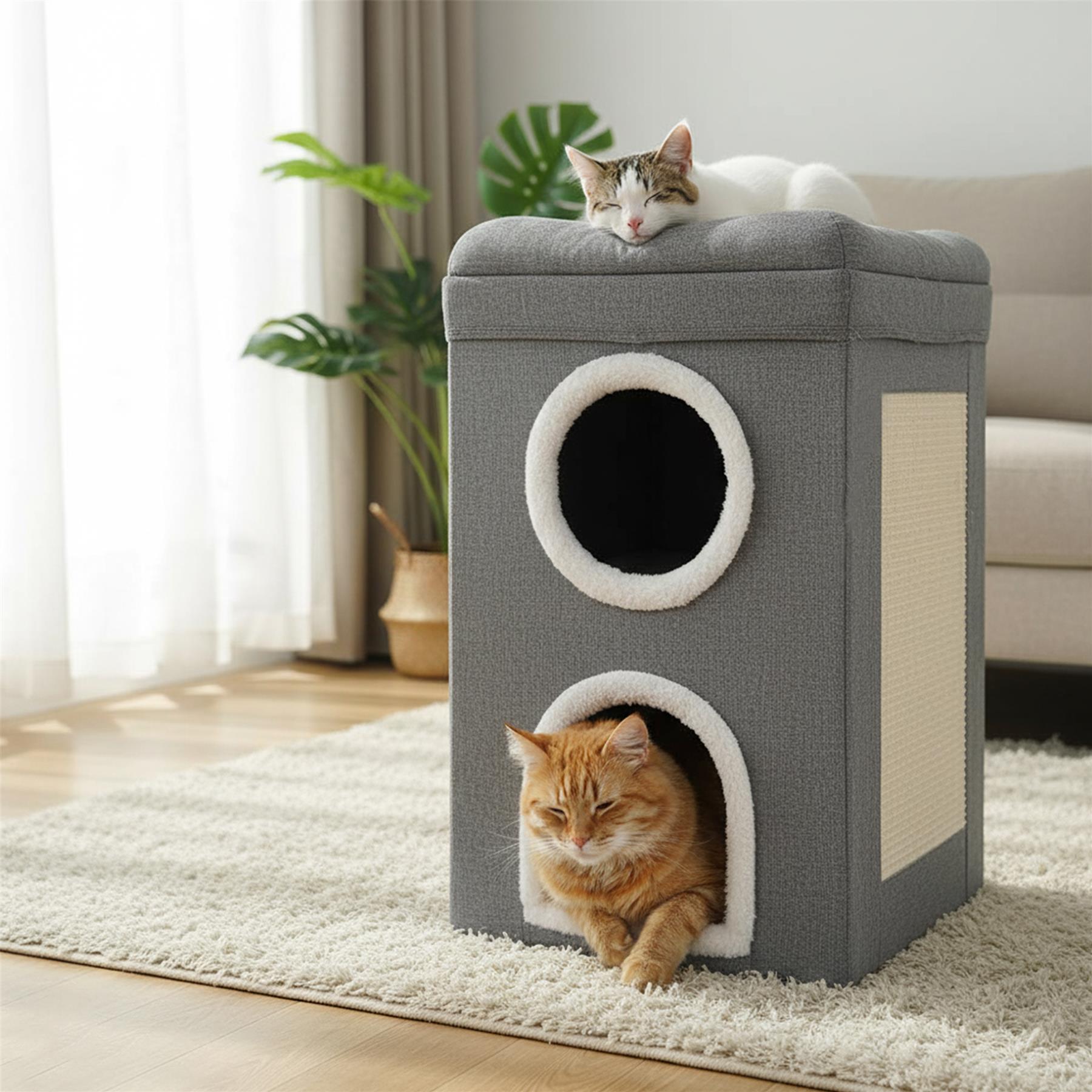 A grey, two-story cat house with a white, fluffy interior. Two cats, one orange and one white with brown spots, are sleeping or resting in the house. The orange cat is in the lower, round hole, while the white cat is on top of the house, sleeping. - The Magic Toy Shop