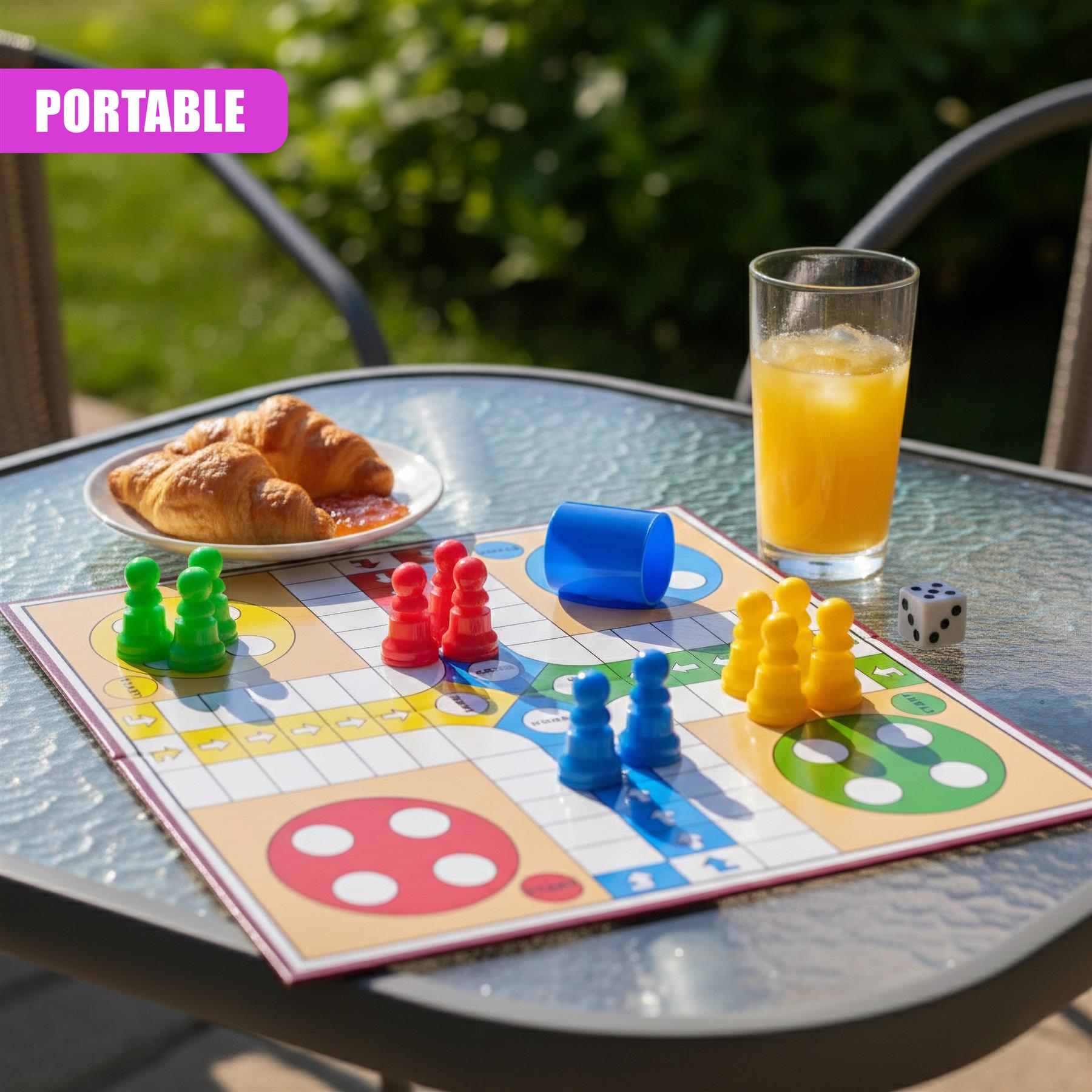 The assembled Ludo game board features colored tokens and dice resting on a table.