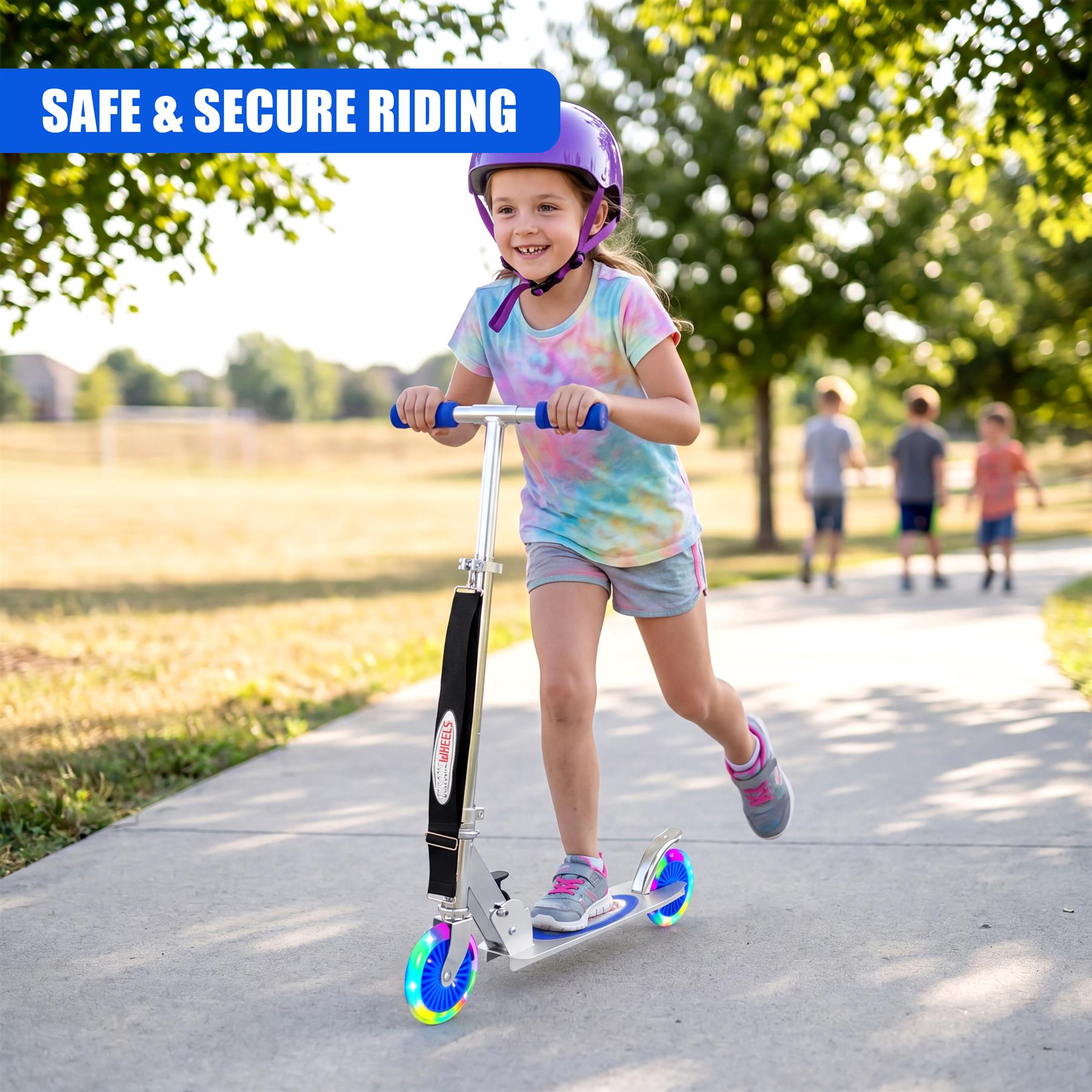 A young girl wearing a helmet rides a blue and silver scooter outdoors on a sunlit sidewalk.