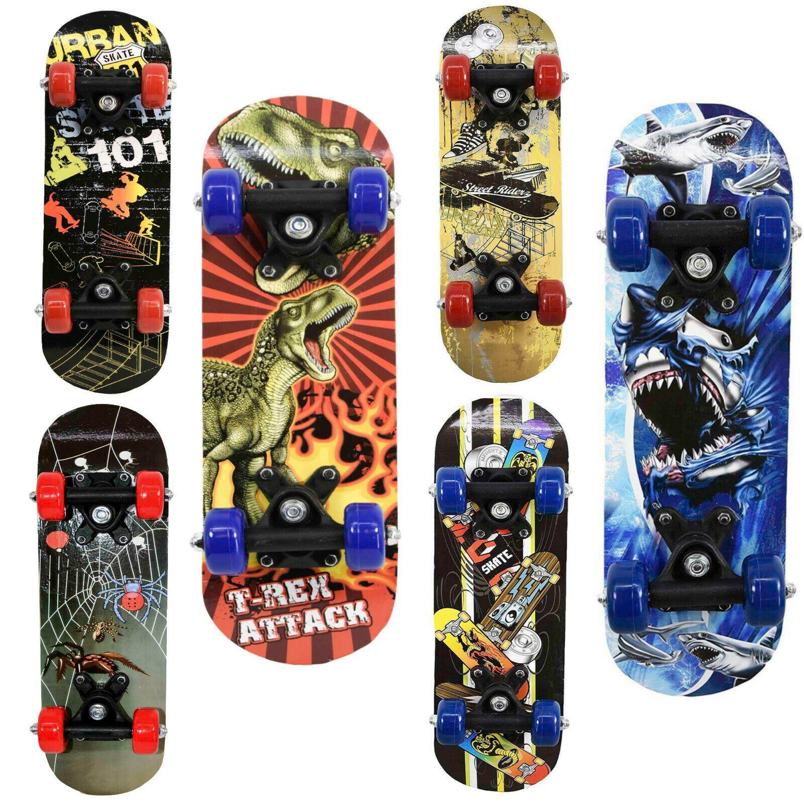 A set of six skateboards featuring diverse themed graphics, ranging from skulls and dinosaurs to abstract designs.