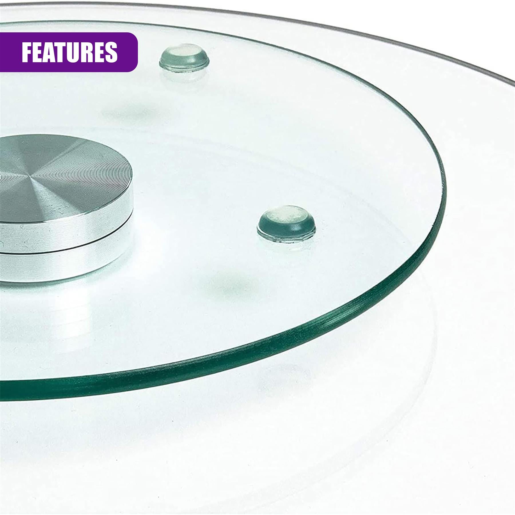 Round glass turntable featuring a central metal base and two small, clear, attached glass domes.