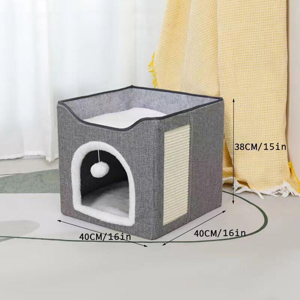 A cat house made of grey fabric with a white interior and a hole for a cat to enter and exit. - The Magic Toy Shop