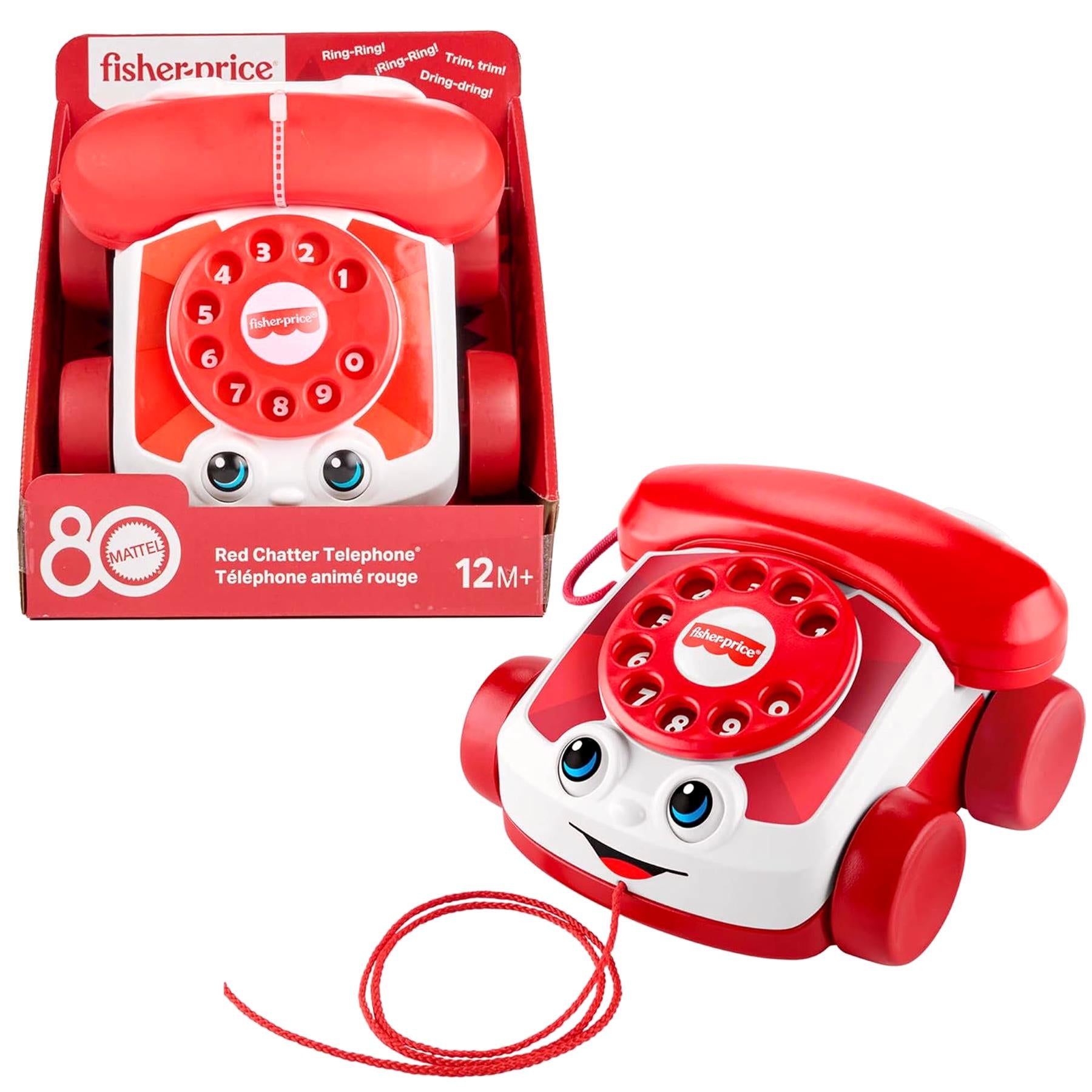 Red toy telephone featuring a rotary dial, speaker, and red cord, displayed with its packaging.