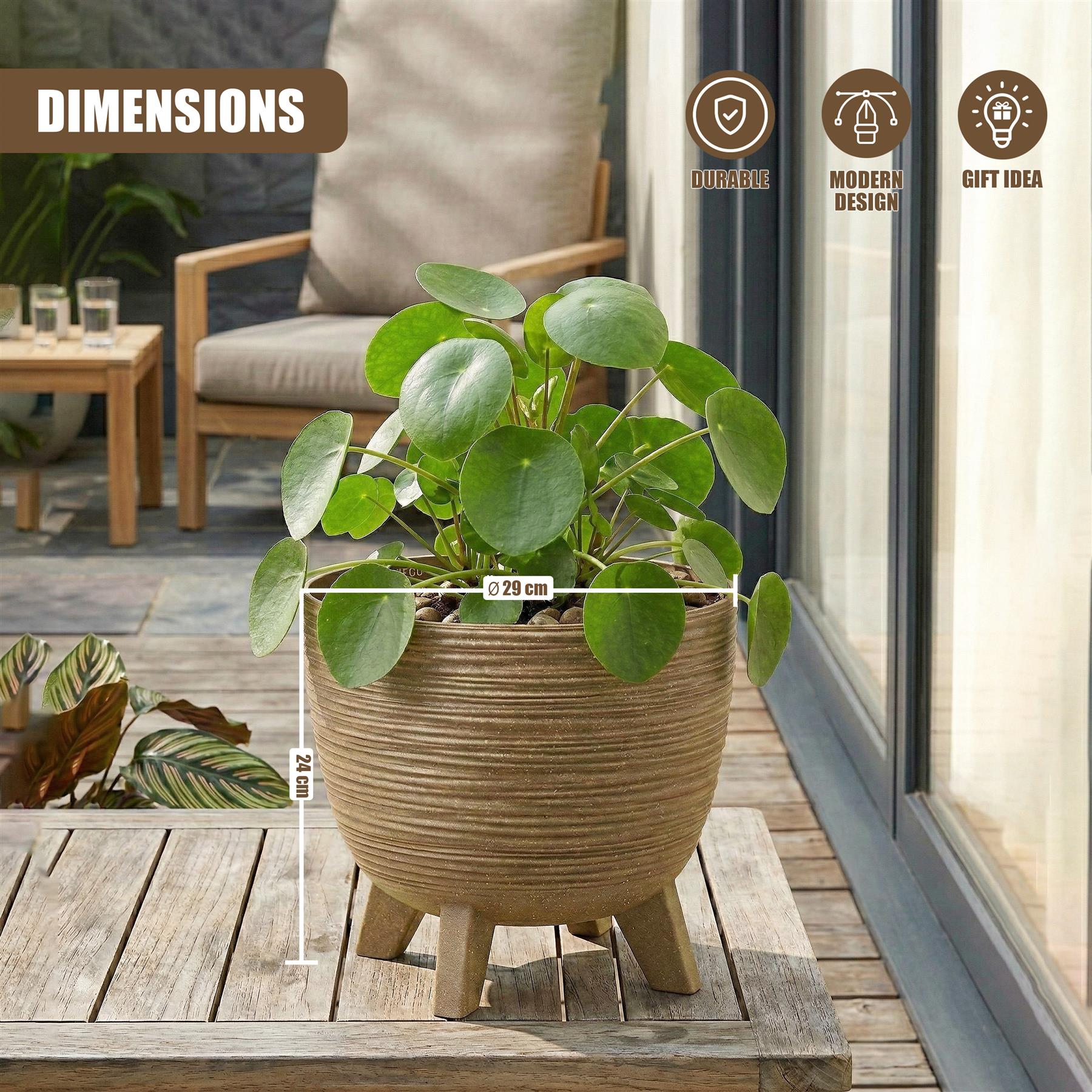 A brown, ribbed flower pot with legs holds a healthy, leafy green houseplant.