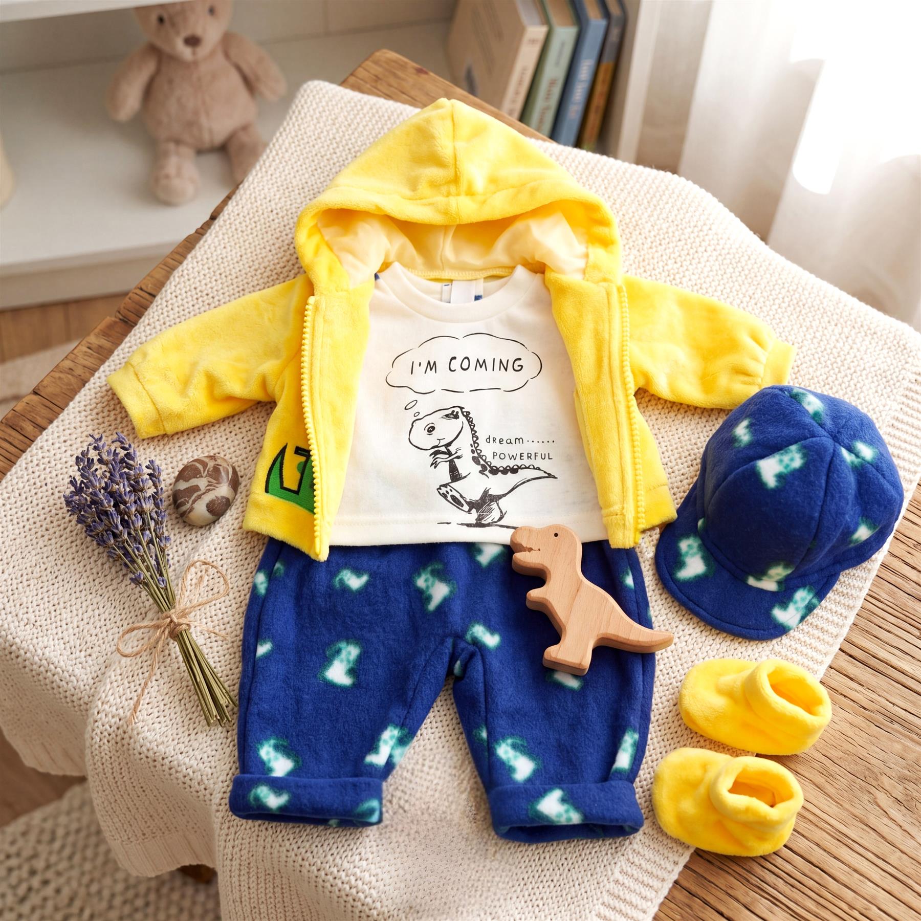 Yellow hooded jacket, white t-shirt, blue spotted joggers, and matching accessories for doll play.
