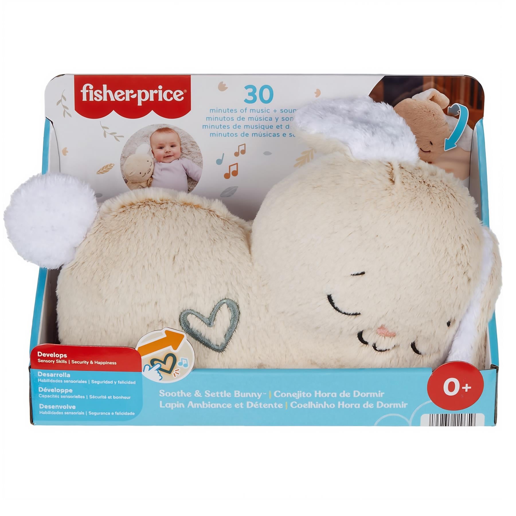 A plush light tan bunny toy with stitched heart features, displayed inside its branded box.