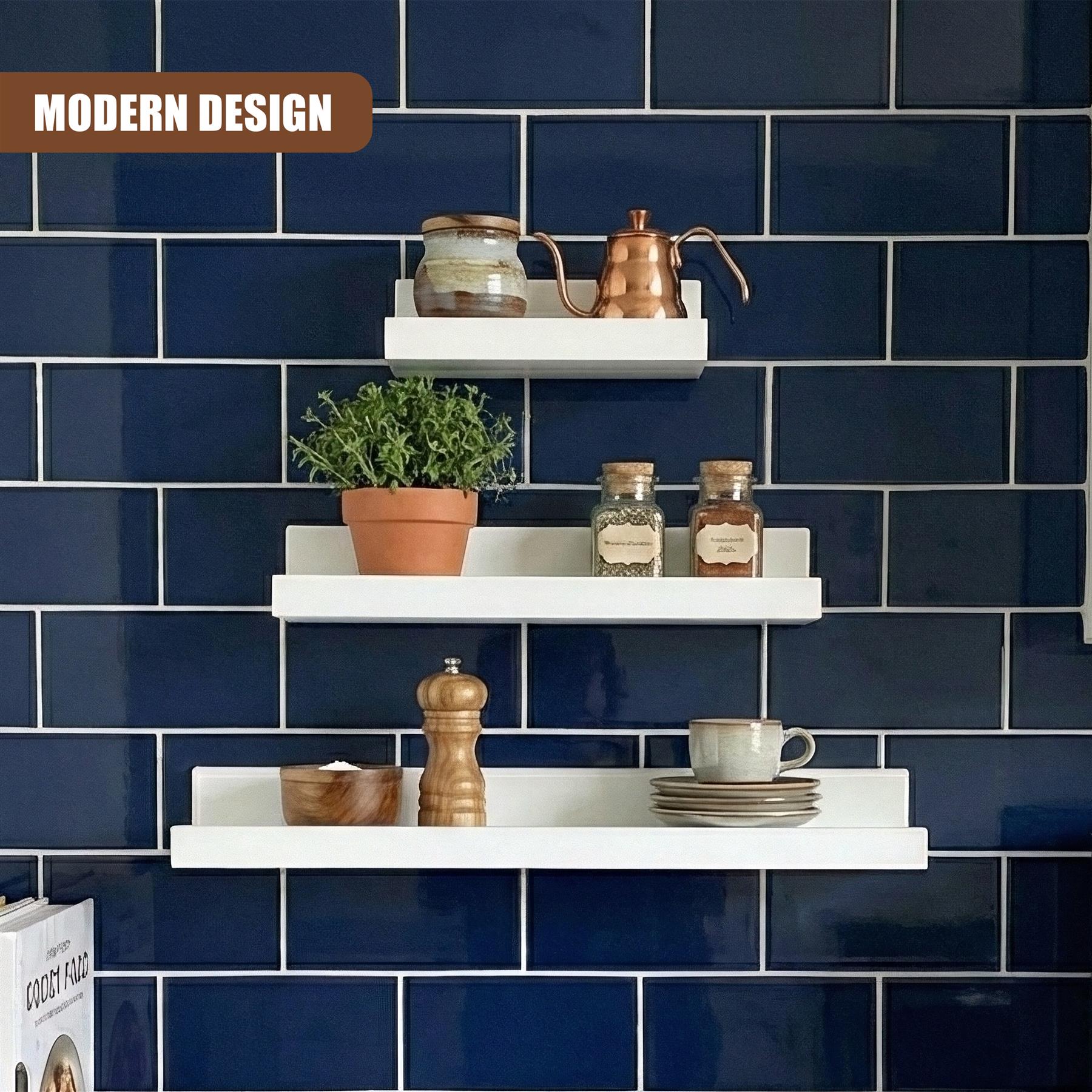 A set of three modern white floating shelves, designed for wall-mounted storage. The shelves feature a clean, minimalist design and are made of high-quality materials. They are ideal for adding a touch of modernity to any room, and can be used to store a variety of items, from books and books to decorative objects and more. - The Magic Toy Shop
