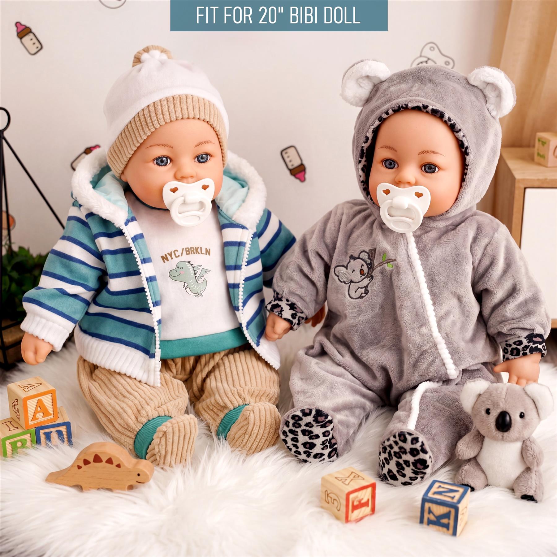 Doll outfits shown: blue striped jacket and gray koala hooded costume. Accessories include large blocks and small toys.