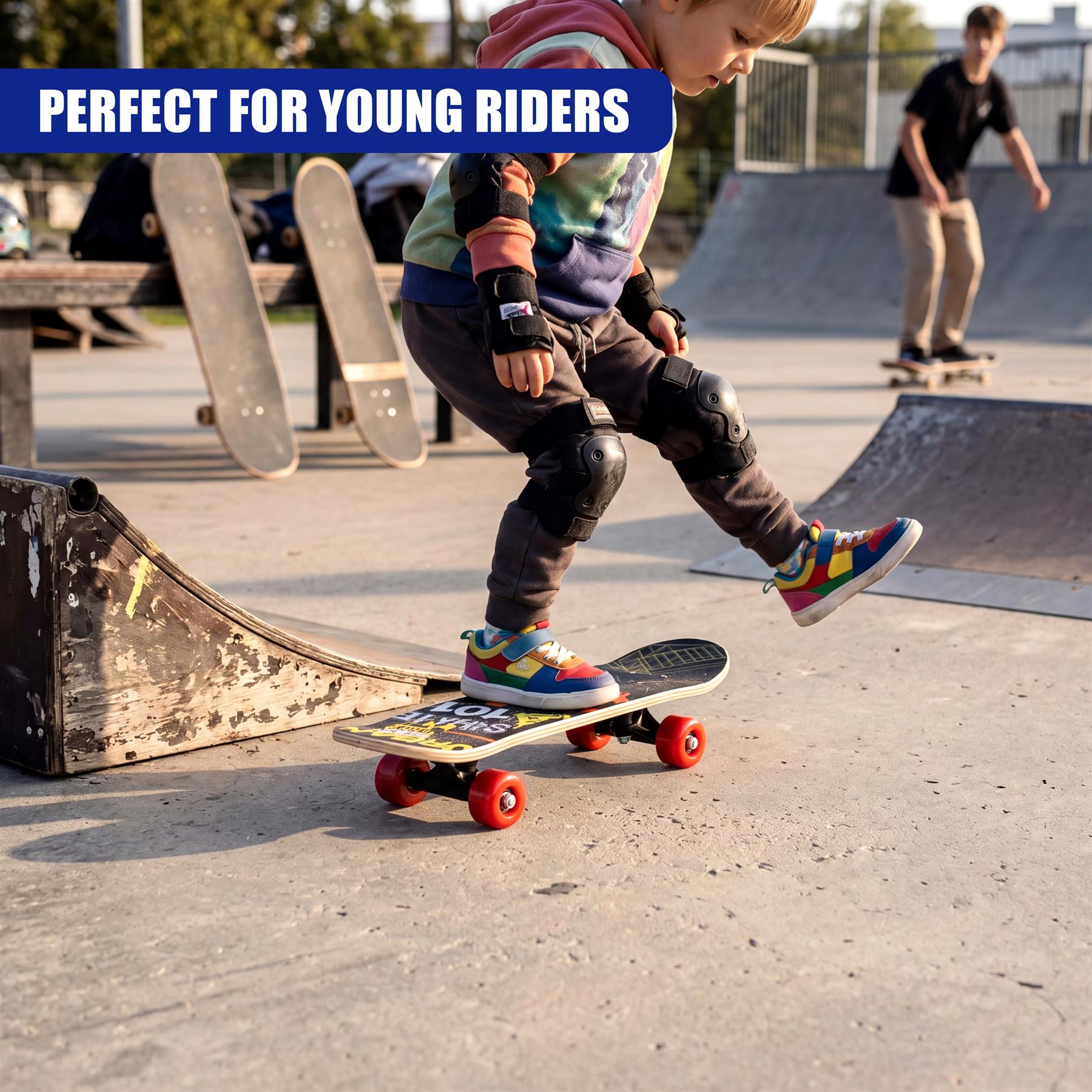 Boy skateboarding on a blue and yellow board at a concrete outdoor skate park.