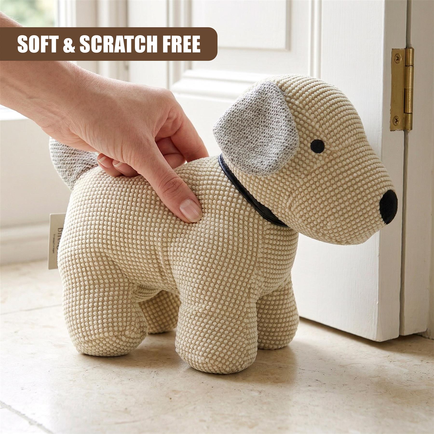 Knitted dog-shaped door stopper rests on a floor surface near a white door.