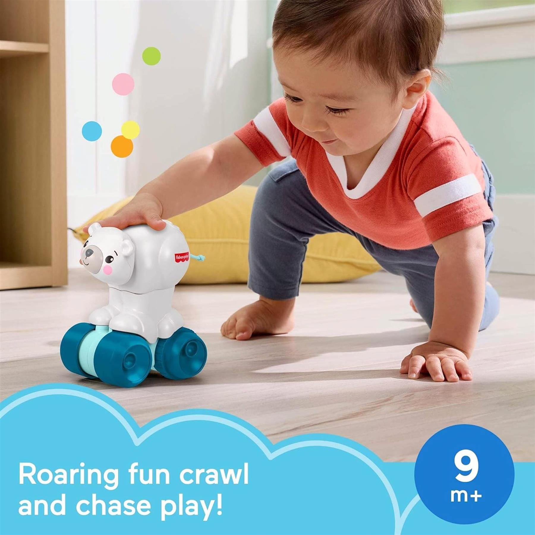 A young child crawls toward a white polar bear toy that features blue wheels and a handle.