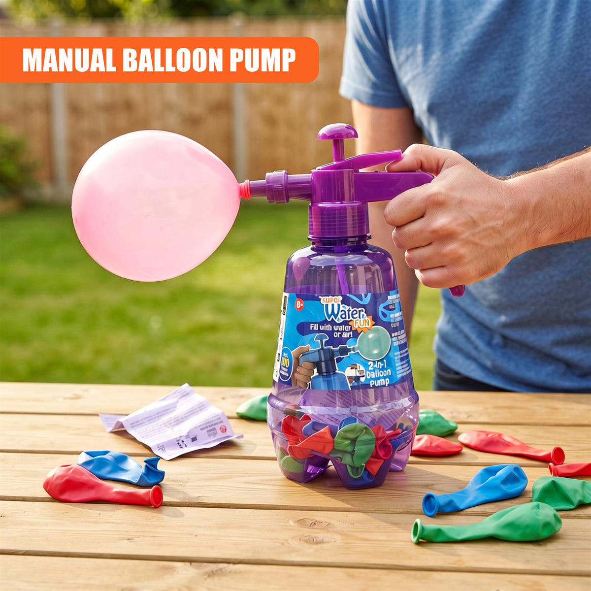 A young person uses a purple 2 in 1 air & water balloon pump with 100 balloons on a wooden table