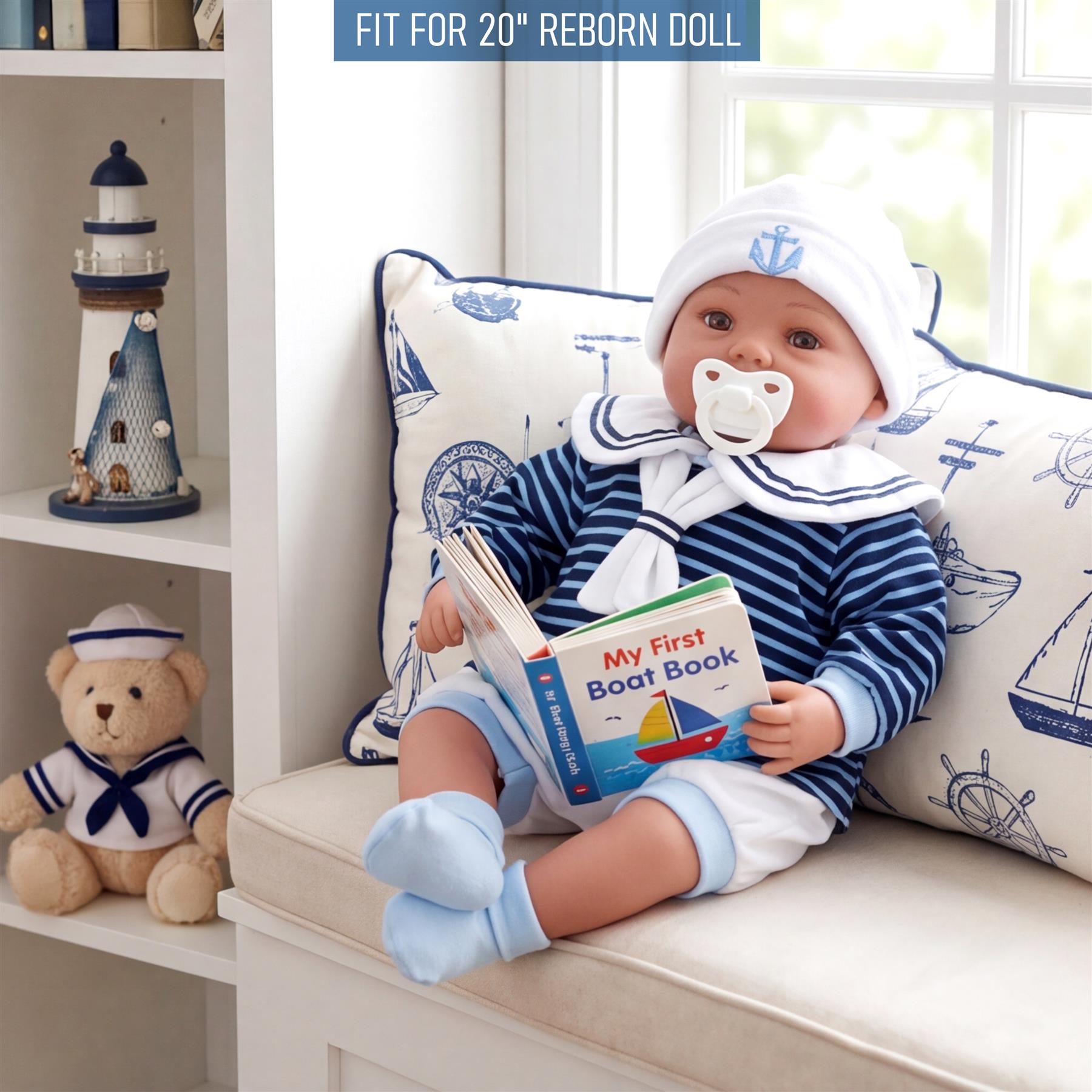 A doll dressed in blue and white sailor stripes sits on a sofa, holding a boat book.