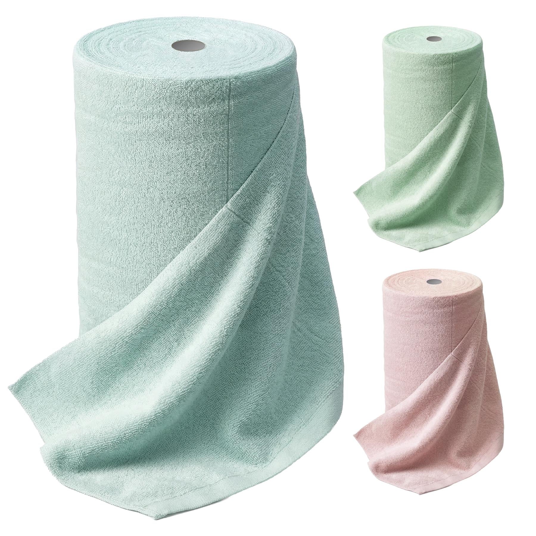 Three rolls of folded microfibre cloths are displayed in mint green, light green, and dusty rose colors.