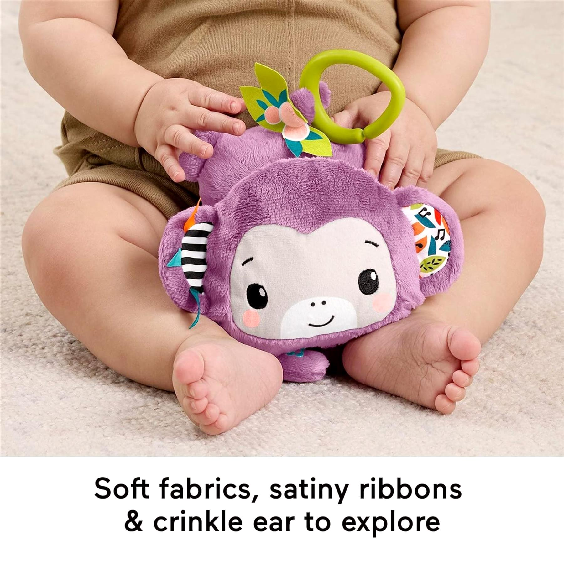Plush purple monkey toy featuring a yellow ring and soft sensory fabrics for infants.