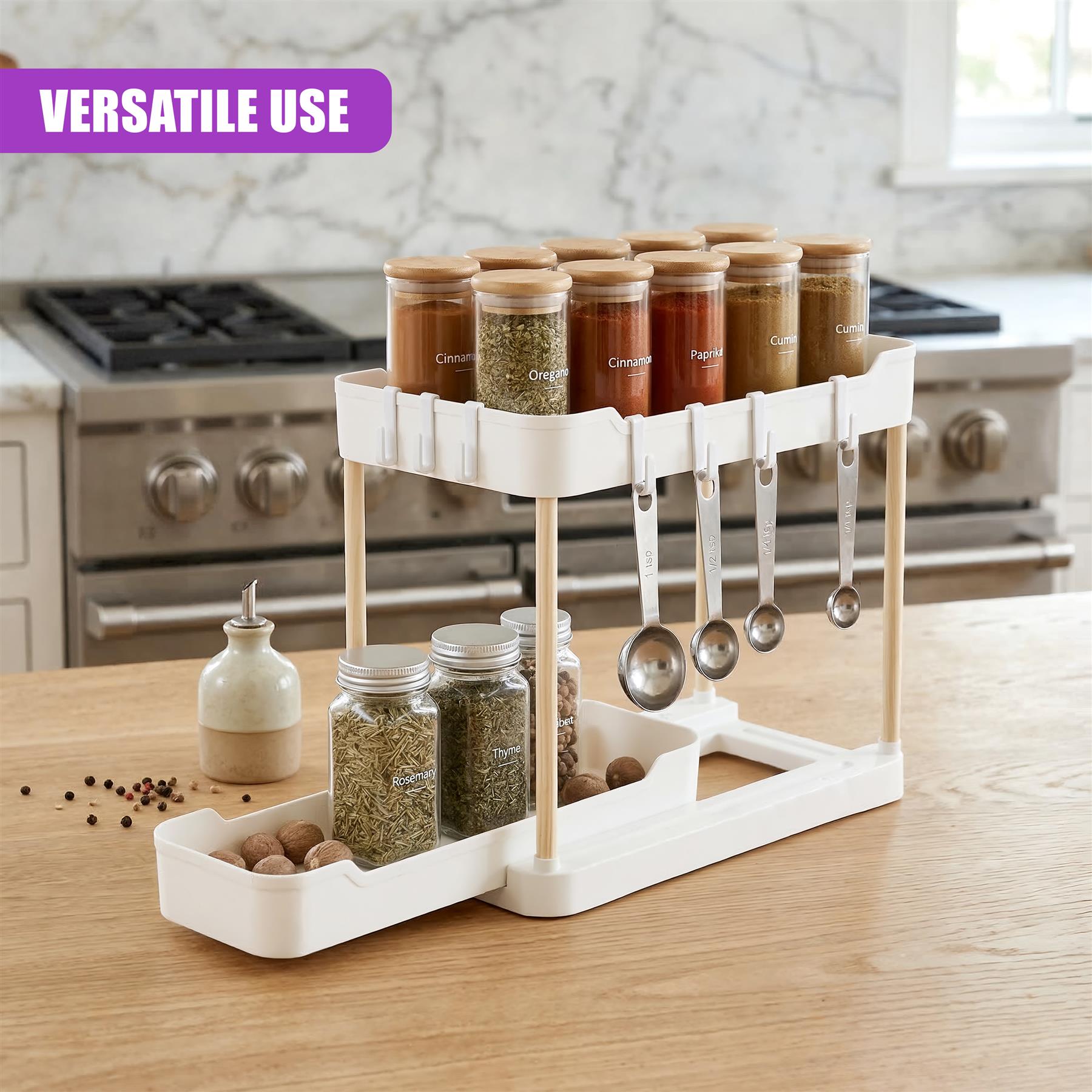 Two-tiered white spice organizer holding jars, seasonings, spoons, and ingredients on a wooden countertop.