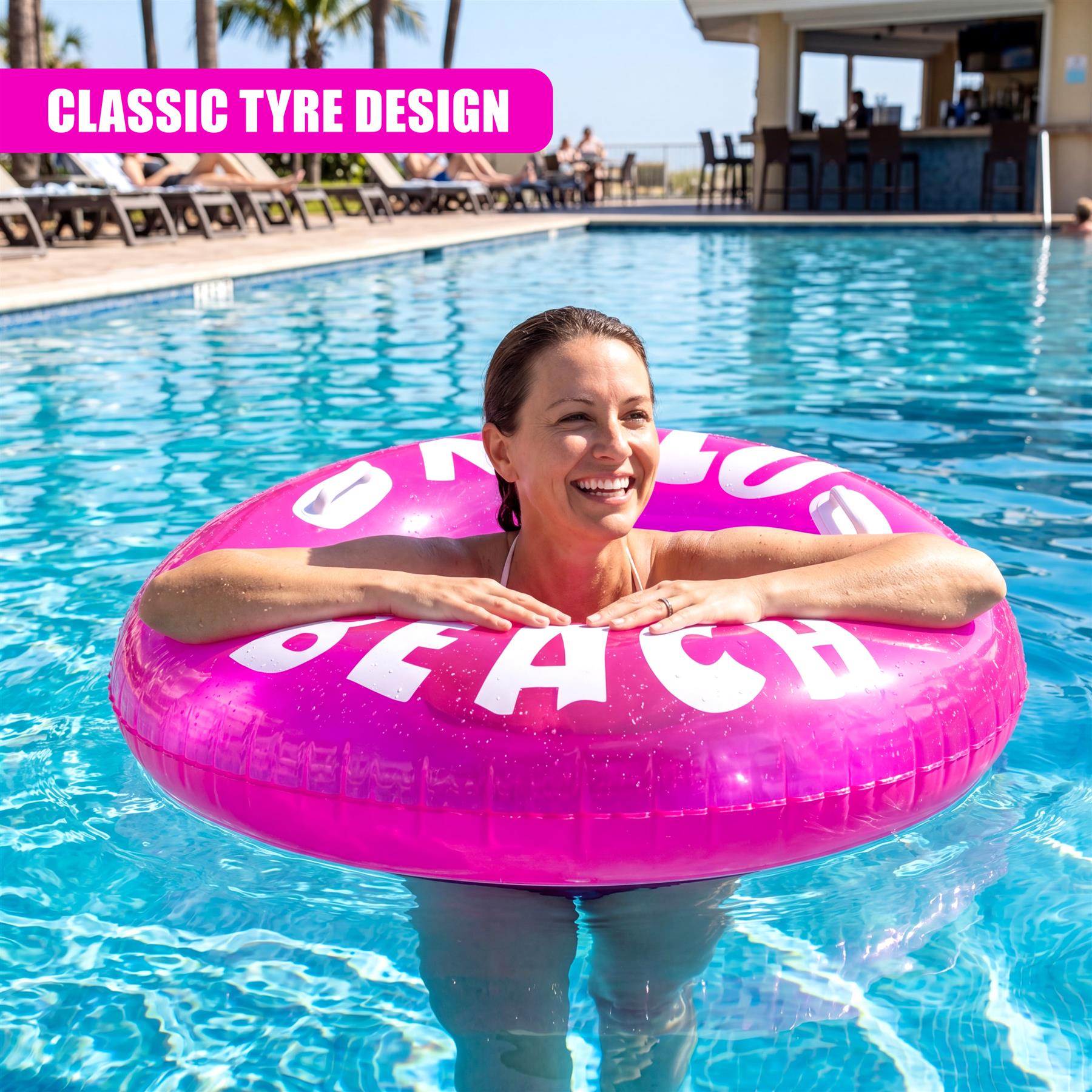 A woman floats in a blue pool on a pink, inflatable ring displaying white letters that read "BEACH."