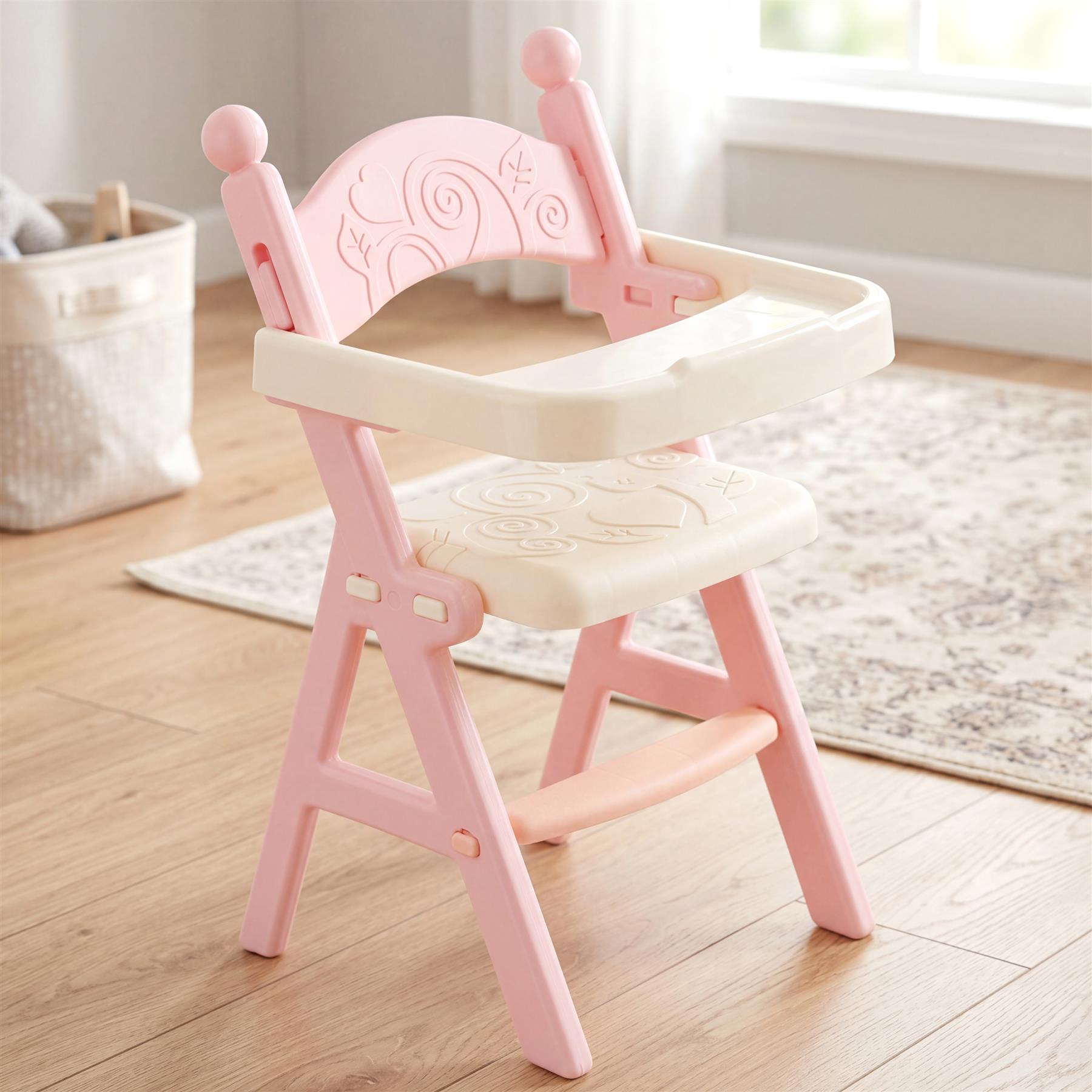 Pink baby doll feeding high chair with attached tray and accessories.