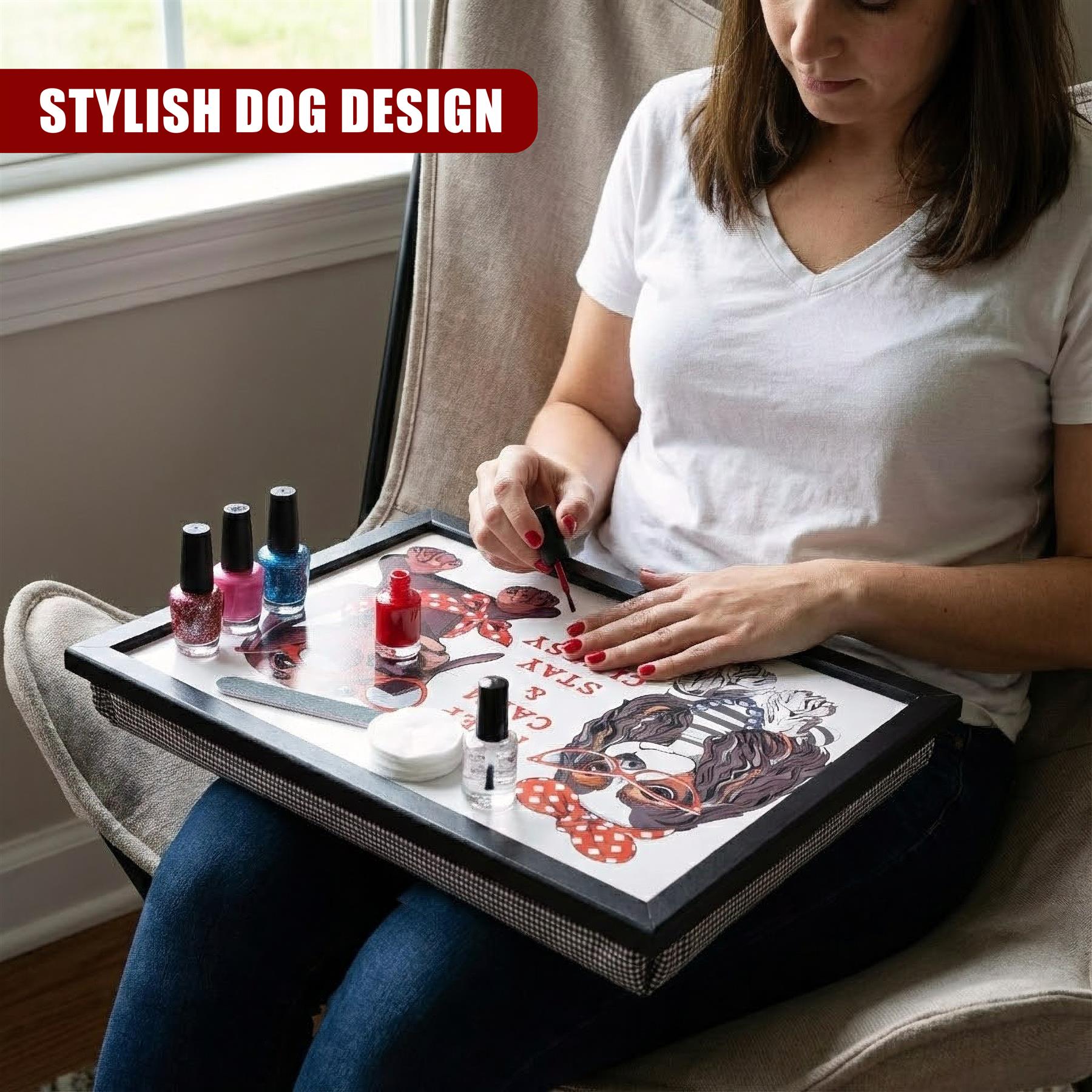 A woman sits on a couch using a tray filled with nail polish bottles and cosmetics.