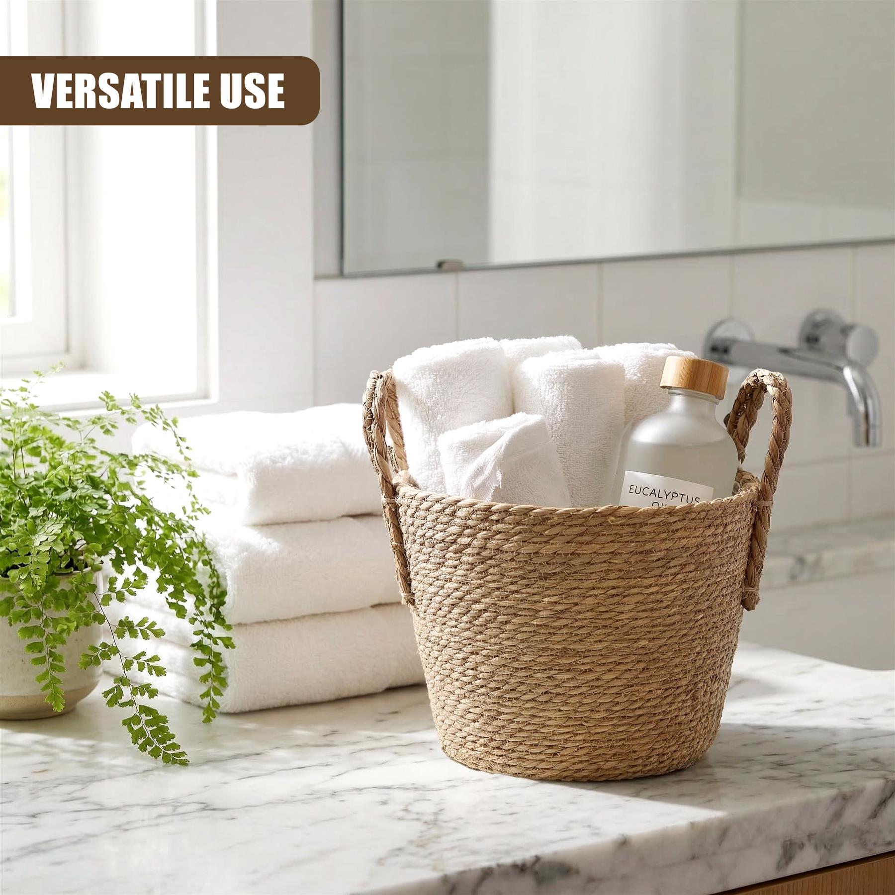 Woven basket containing rolled white towels and a liquid soap dispenser rests on a marble counter.