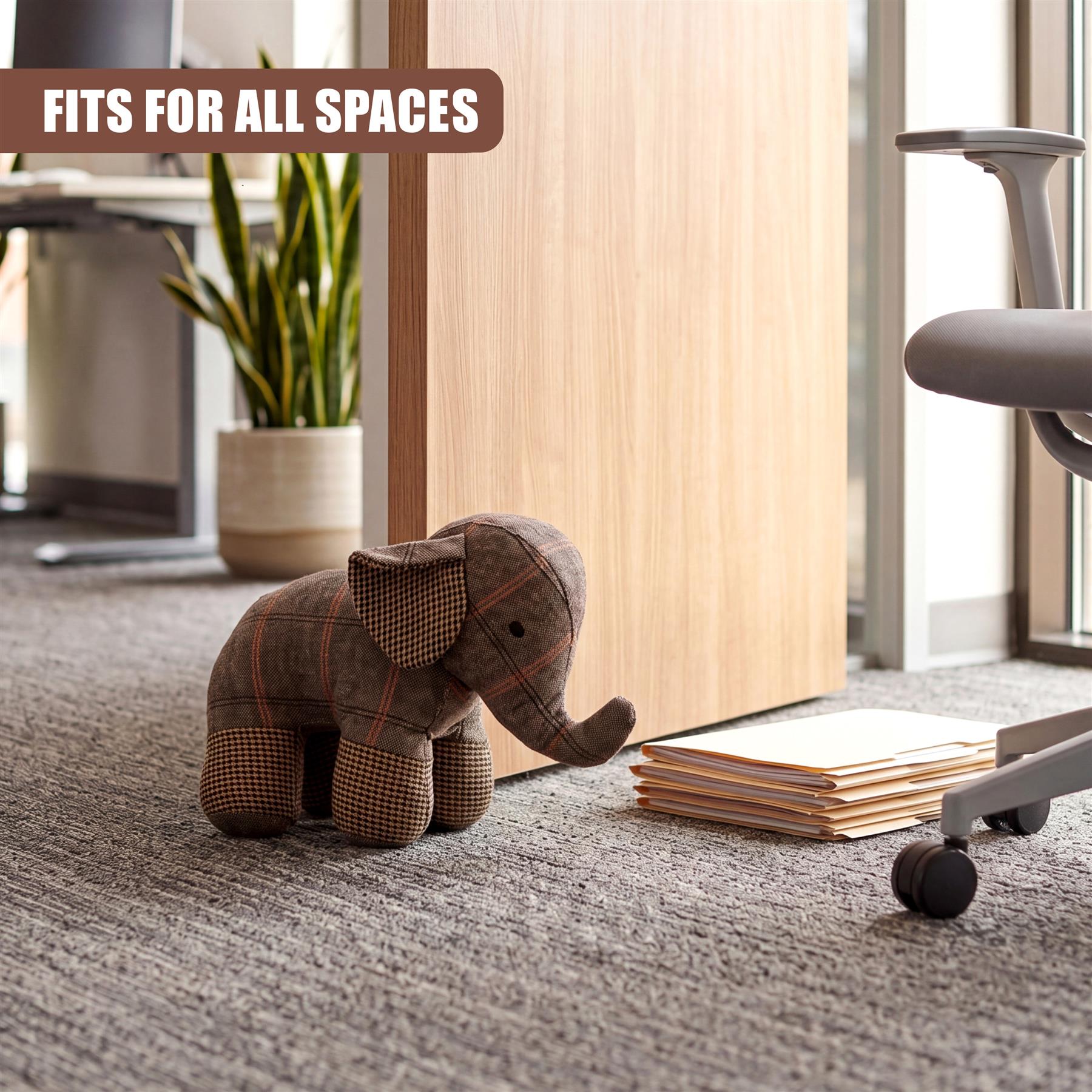 Plaid fabric elephant door stopper resting on a light gray carpet near stacked white papers.