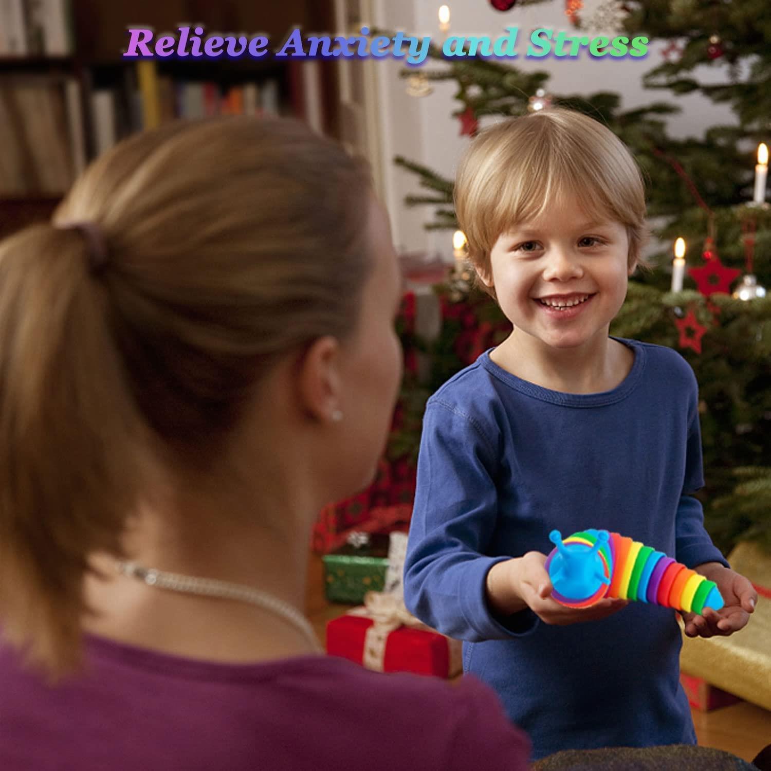 A smiling boy holds a colorful, segmented fidget toy in front of an adult.