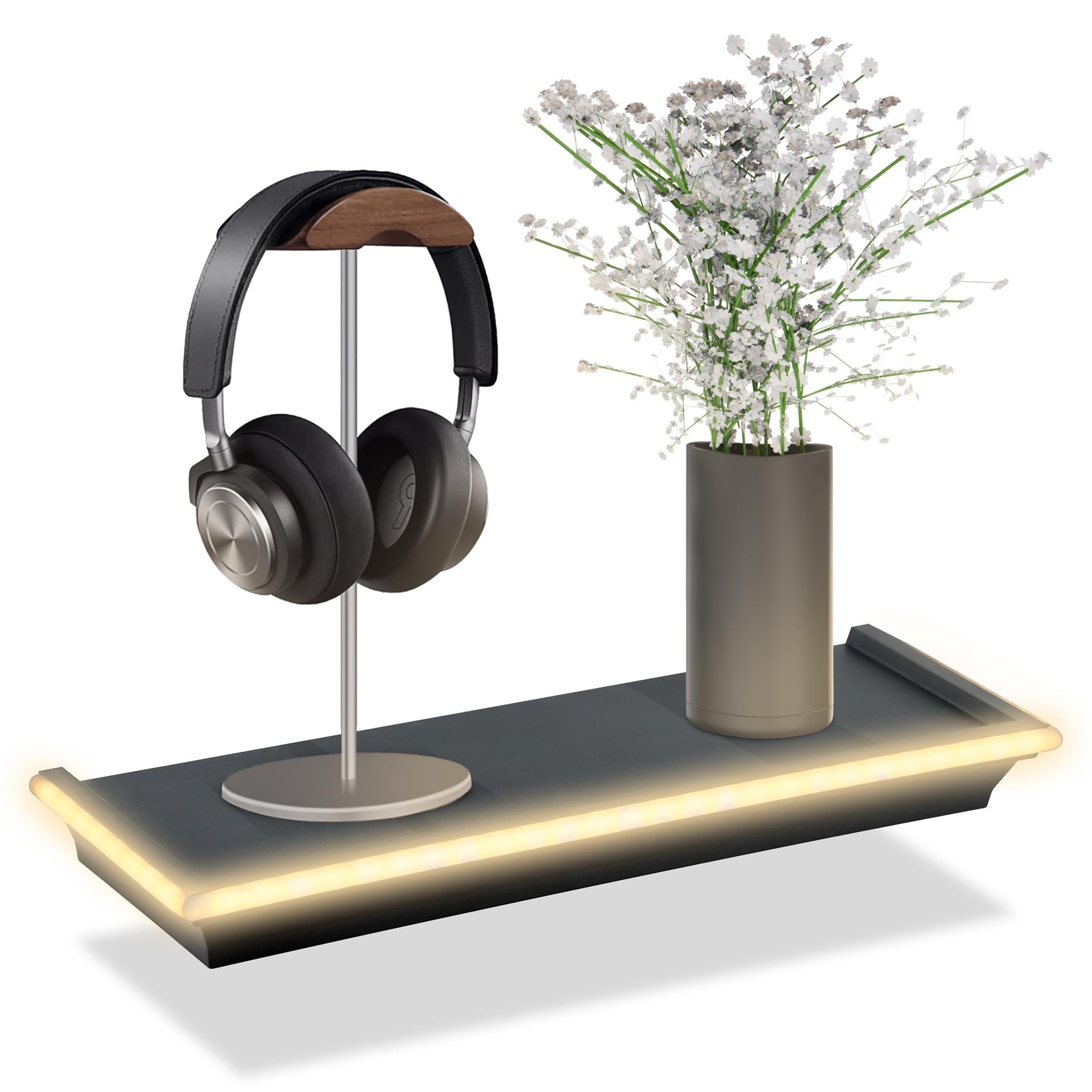 Floating shelf displaying a pair of black headphones on a sleek stand next to a modern vase filled with white flowers. The shelf is accentuated with LED neon lights along the edge, creating a stylish display. Ideal for organizing audio accessories and enhancing home decor. Available at themagictoyshop.