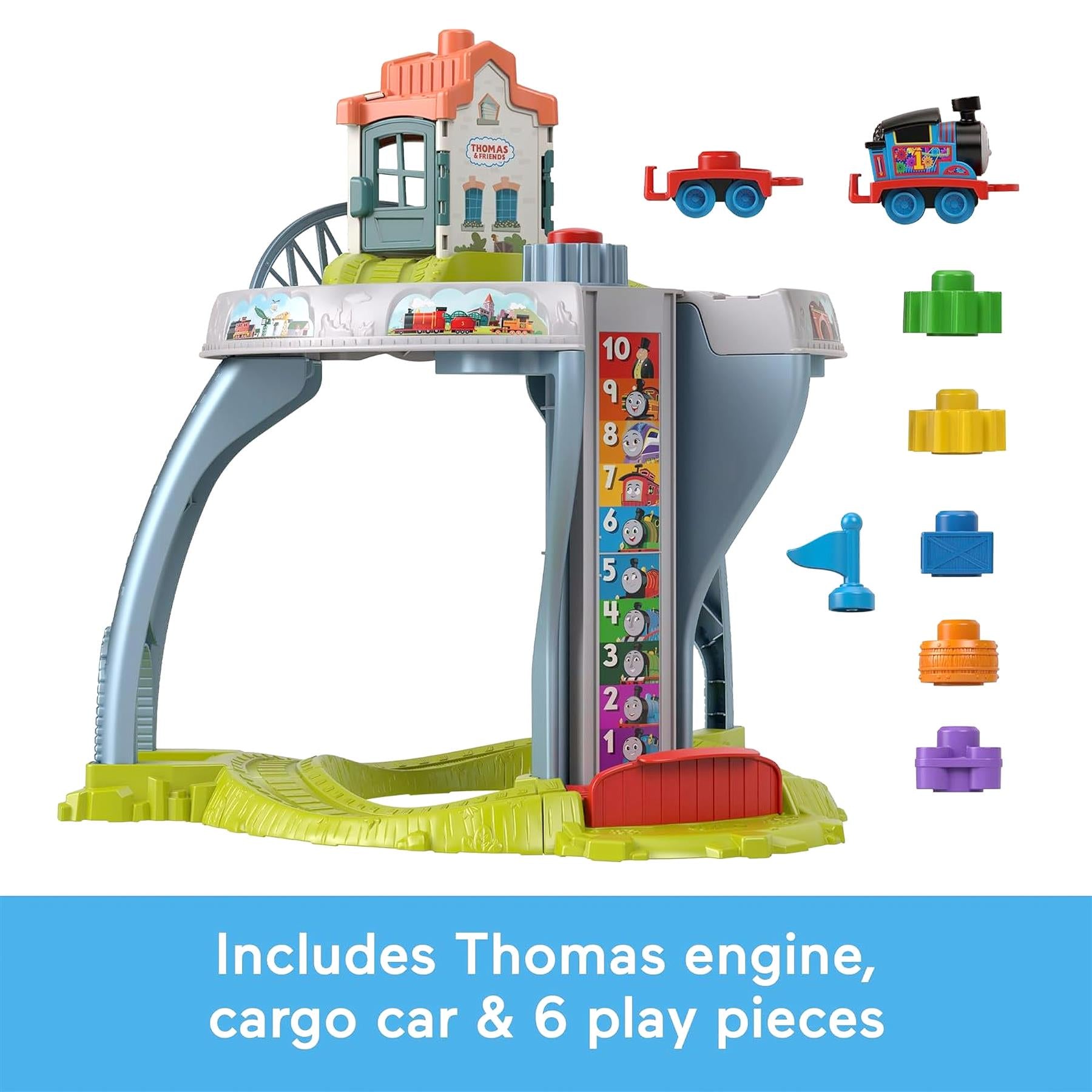 The Thomas train table features tracks, a station, and accessories including cars, cargo, and a train engine.