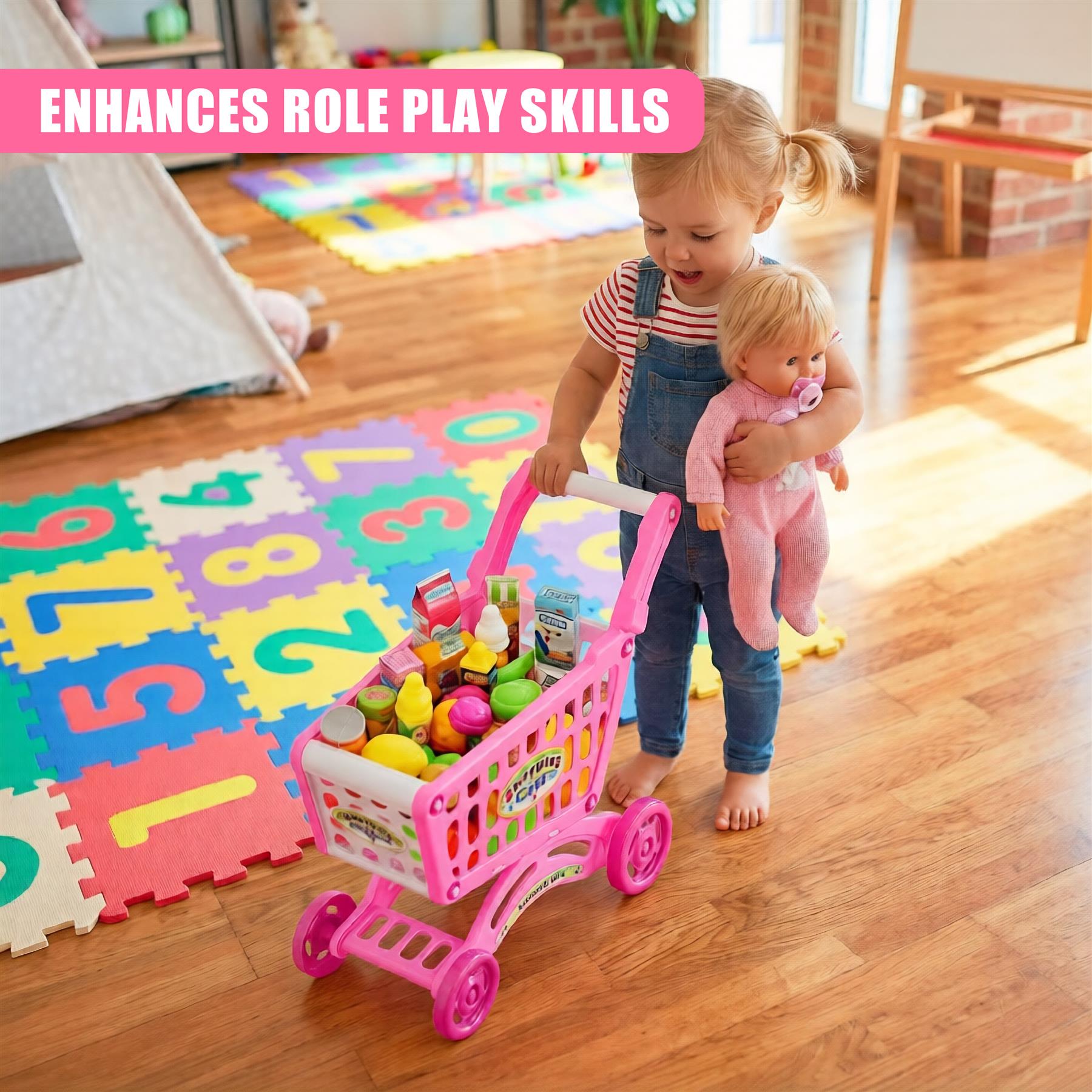 "Pink shopping trolley with colorful food items and toy baby, on wooden floor." - The Magic Toy Shop
