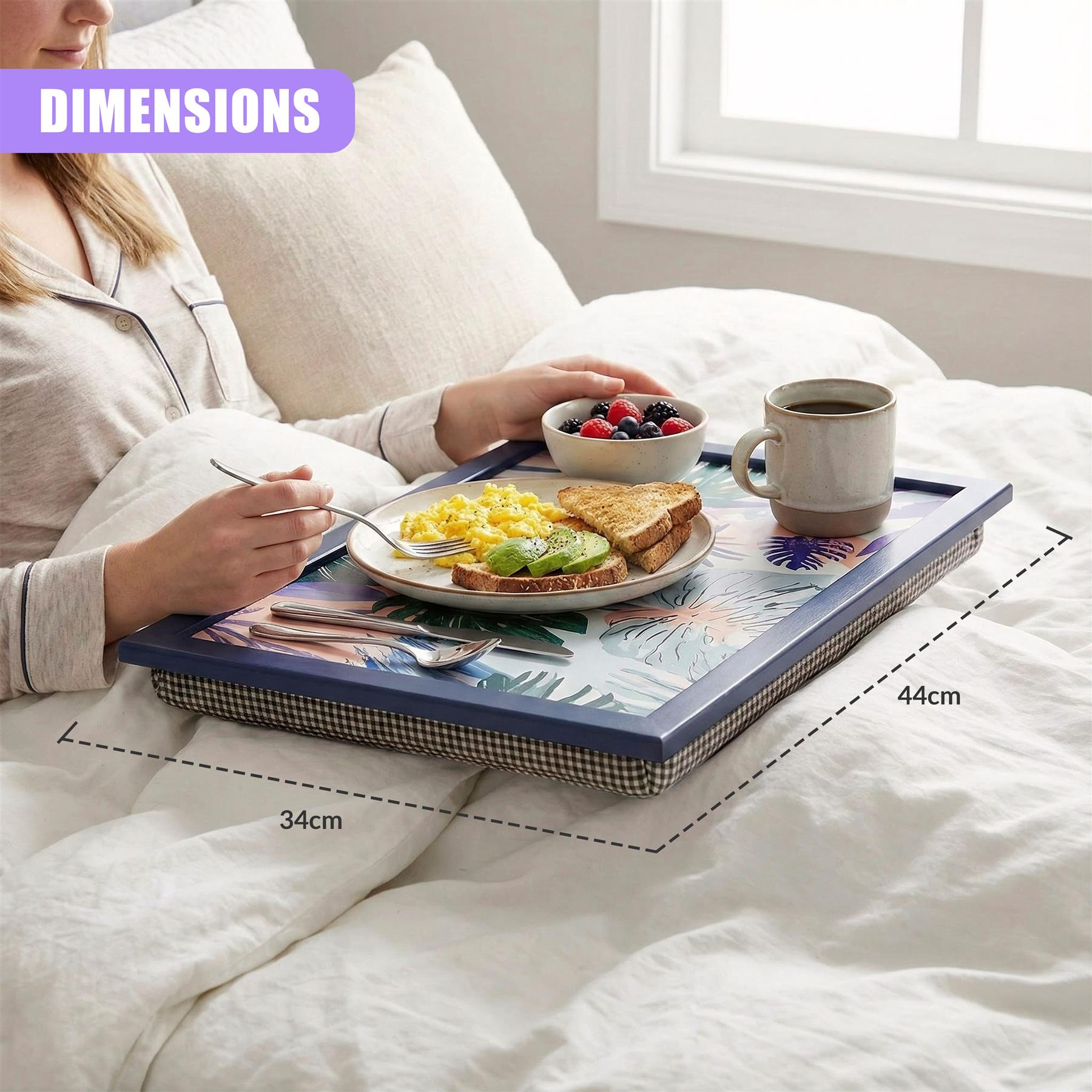 The rectangular lap tray features a palm leaf design and holds breakfast items like eggs and coffee.