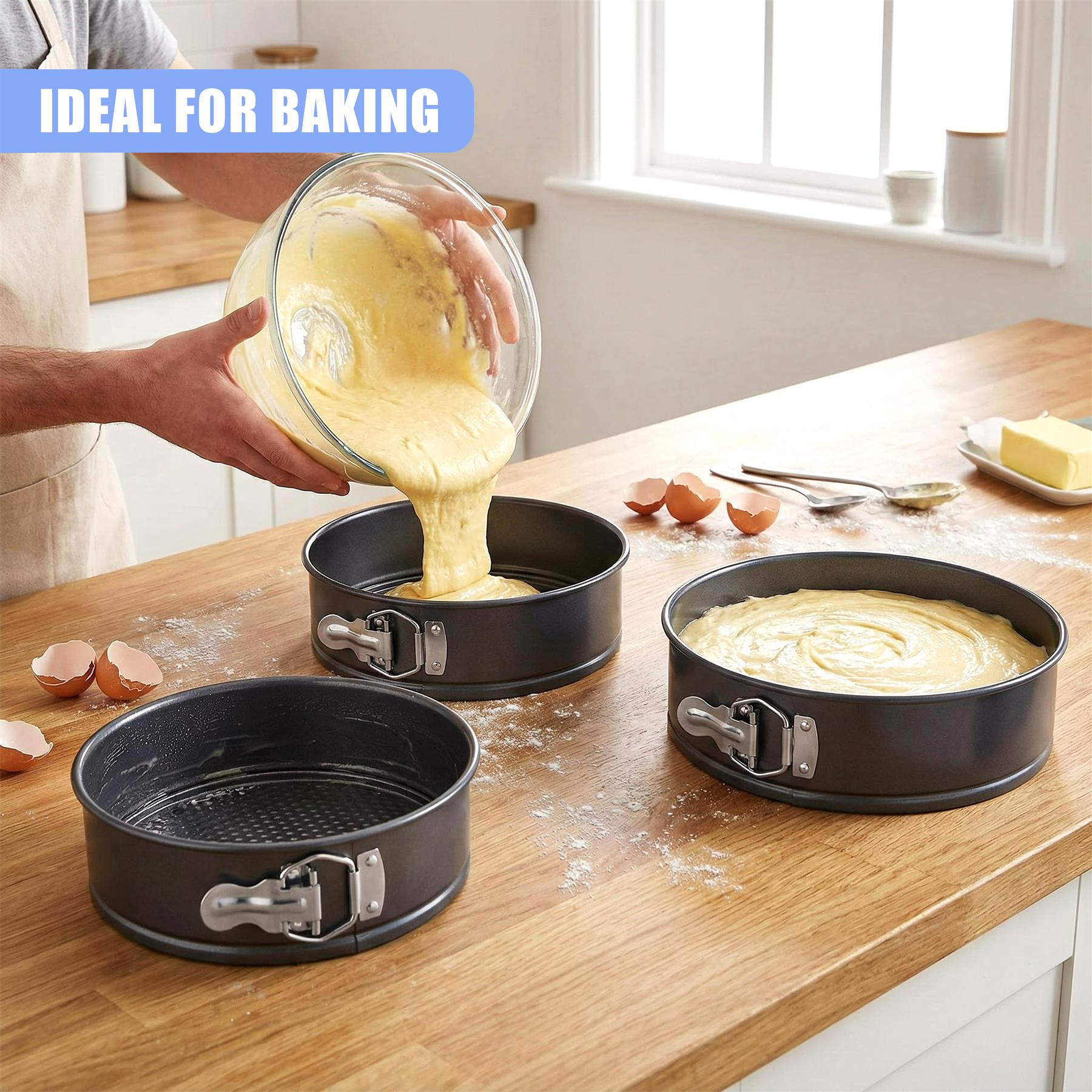 Batter is being poured into the center pan of a three-piece springform cake set on a countertop.