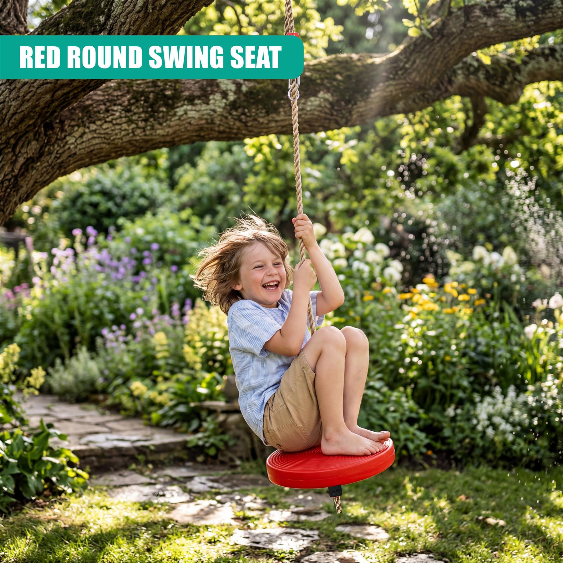 A child swings on a red round seat hanging by ropes from a large tree branch in the garden.