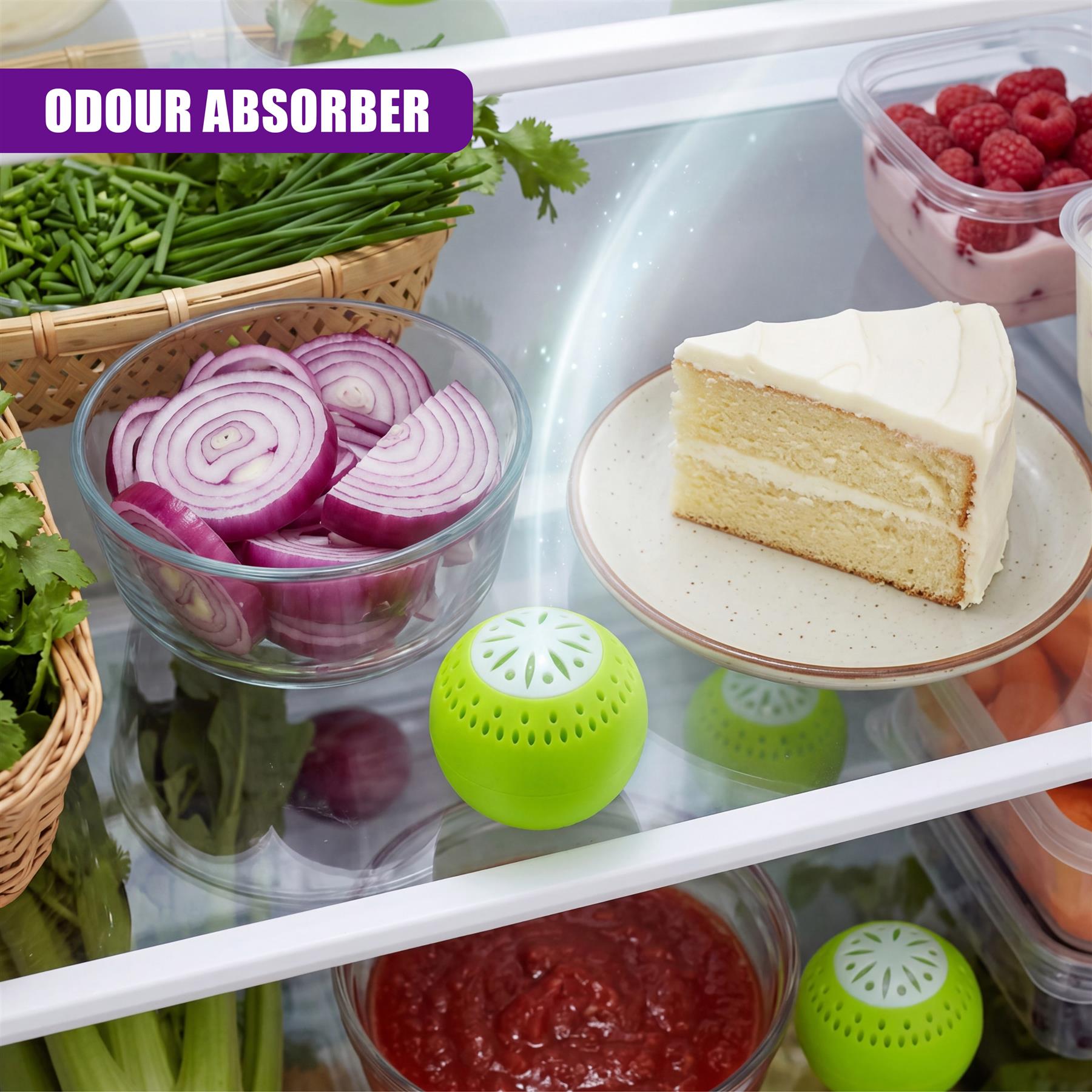 A set of three small, porous, green odor absorber balls rests inside an open refrigerator.