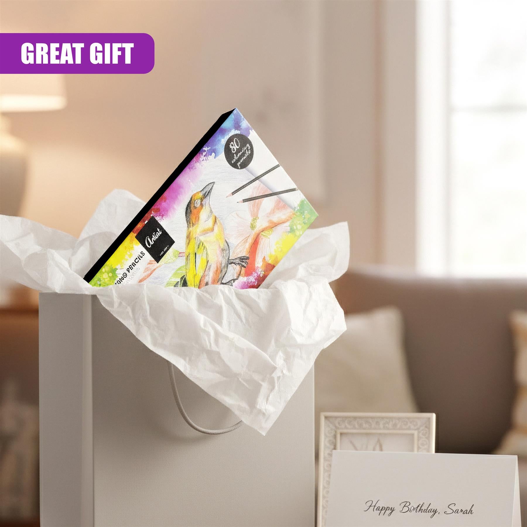 A set of 80 colorful coloring pencils is visible inside a partially opened white gift box.