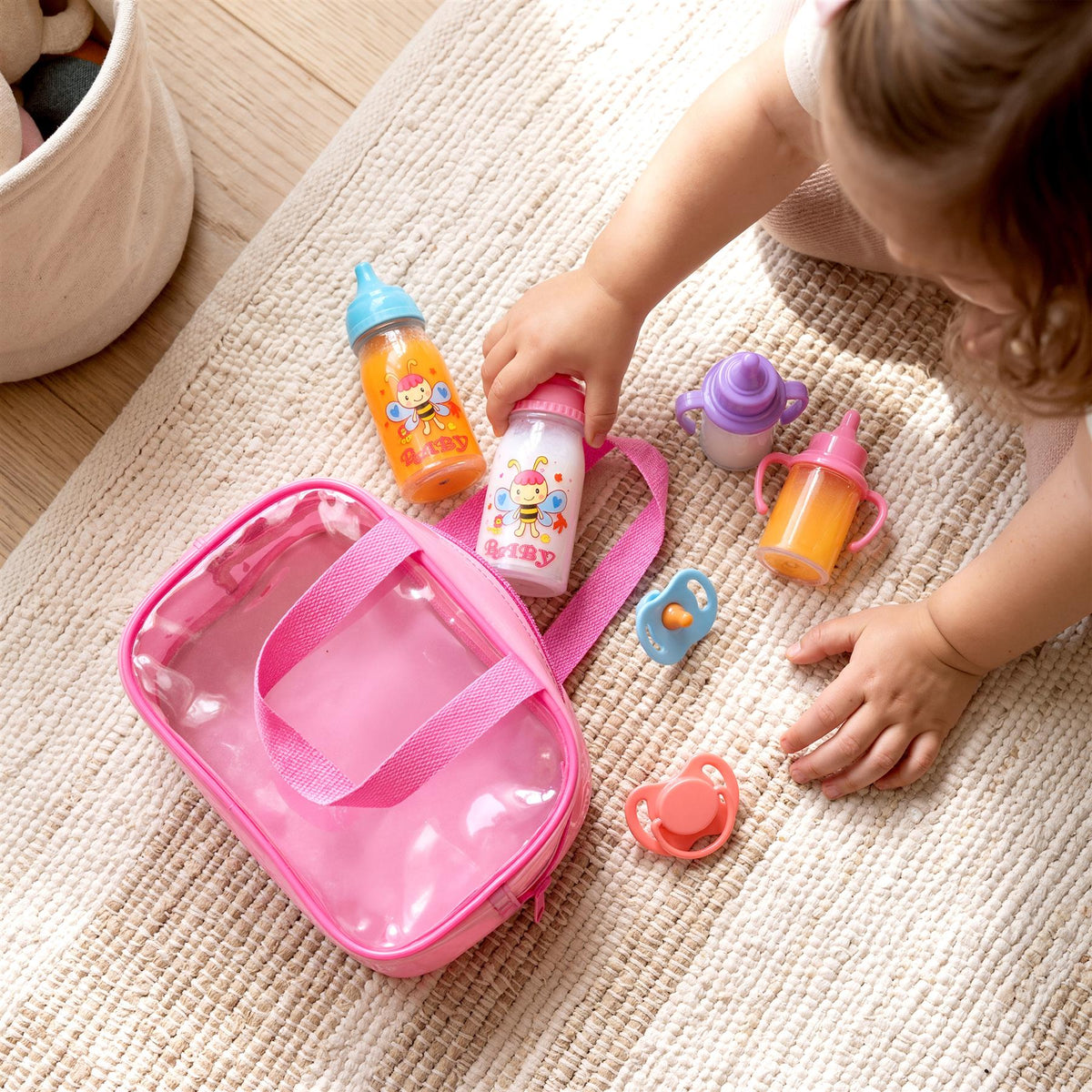 BiBi Doll 7-in-1 baby doll accessories set with bottles and dummies in a pink carry bag