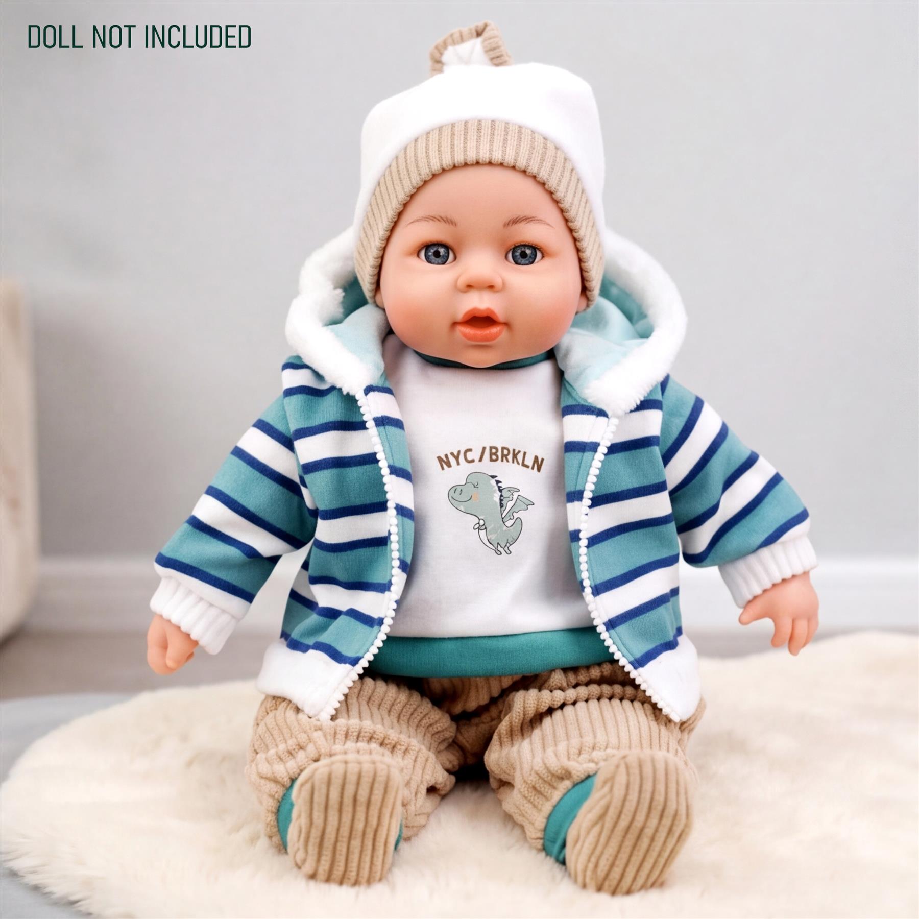 The doll is wearing a blue striped sweater, white hooded top, and beige pants.
