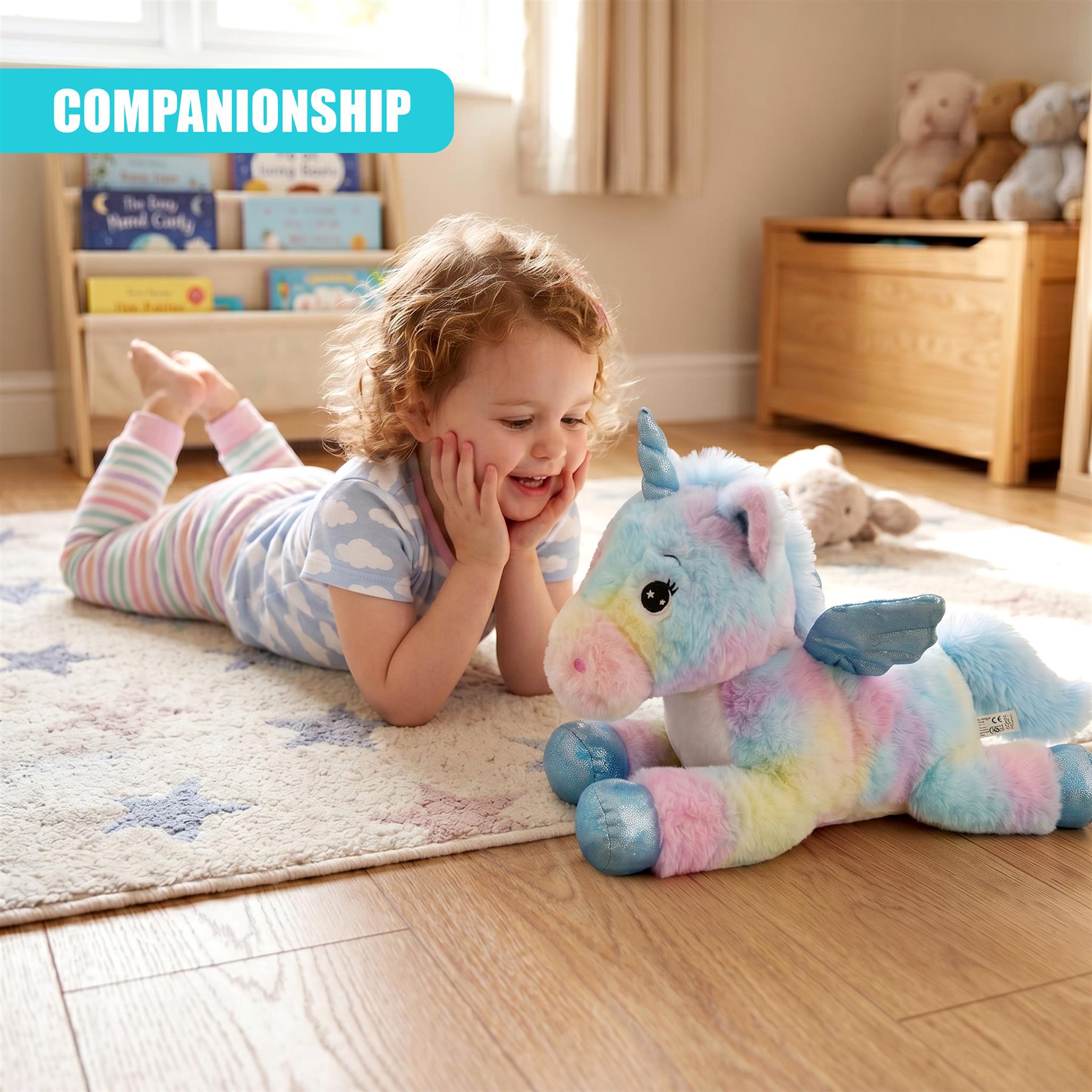 Soft, pastel unicorn plush toy lying on a rug next to a smiling child.