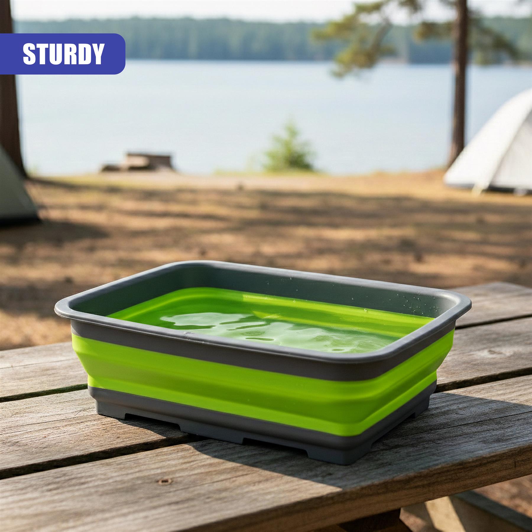 Foldable wash basin bowl in neon green and dark gray, sitting on a weathered wooden table.