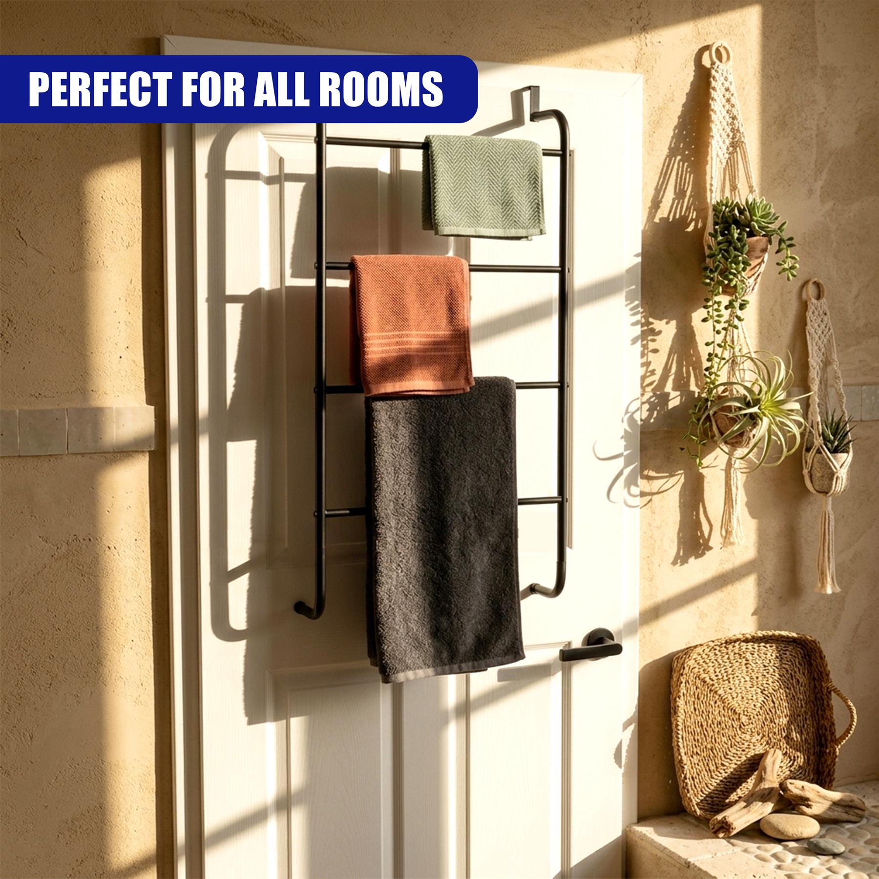 A black towel rail hangs on a white door, displaying three folded towels in various colors.